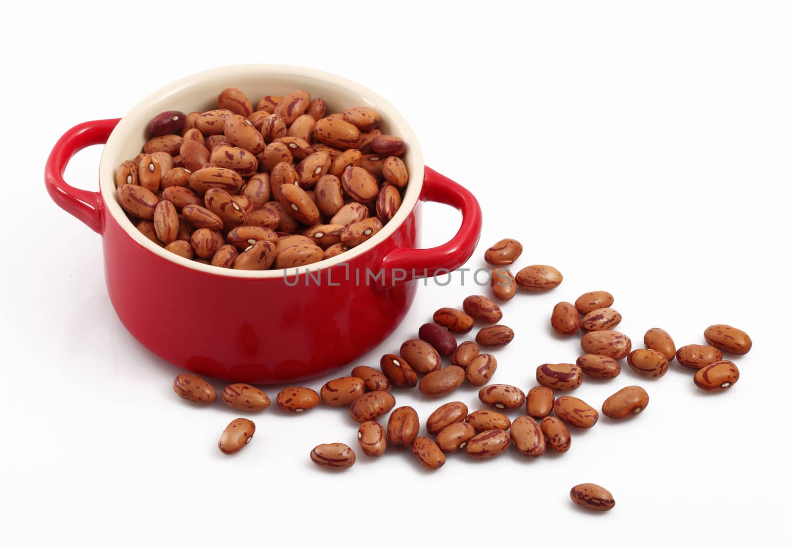 dry beans in pot on white background