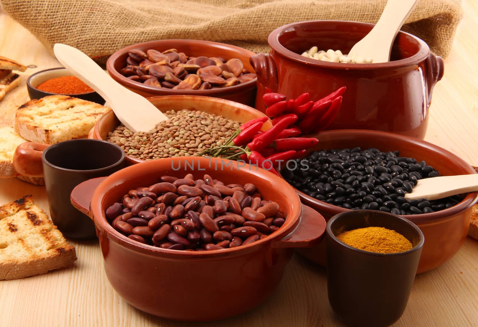 dry legumes in rustic dish on wooden table