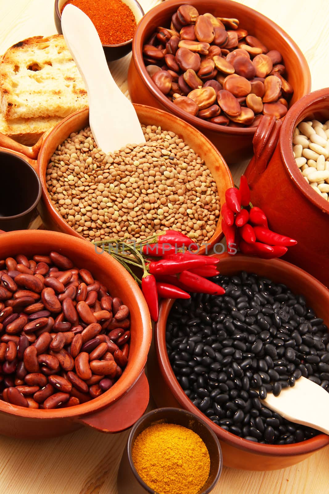 dry legumes in rustic dish on wooden table
