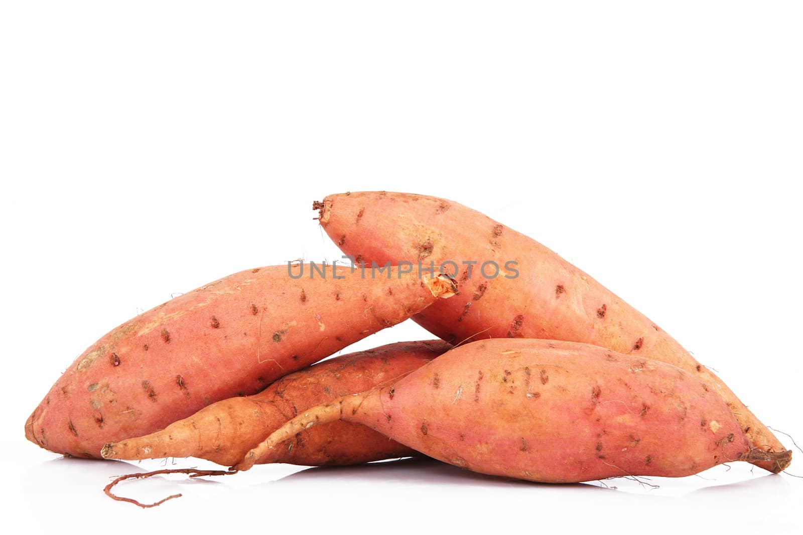 a fresh sweet potatoes on white background