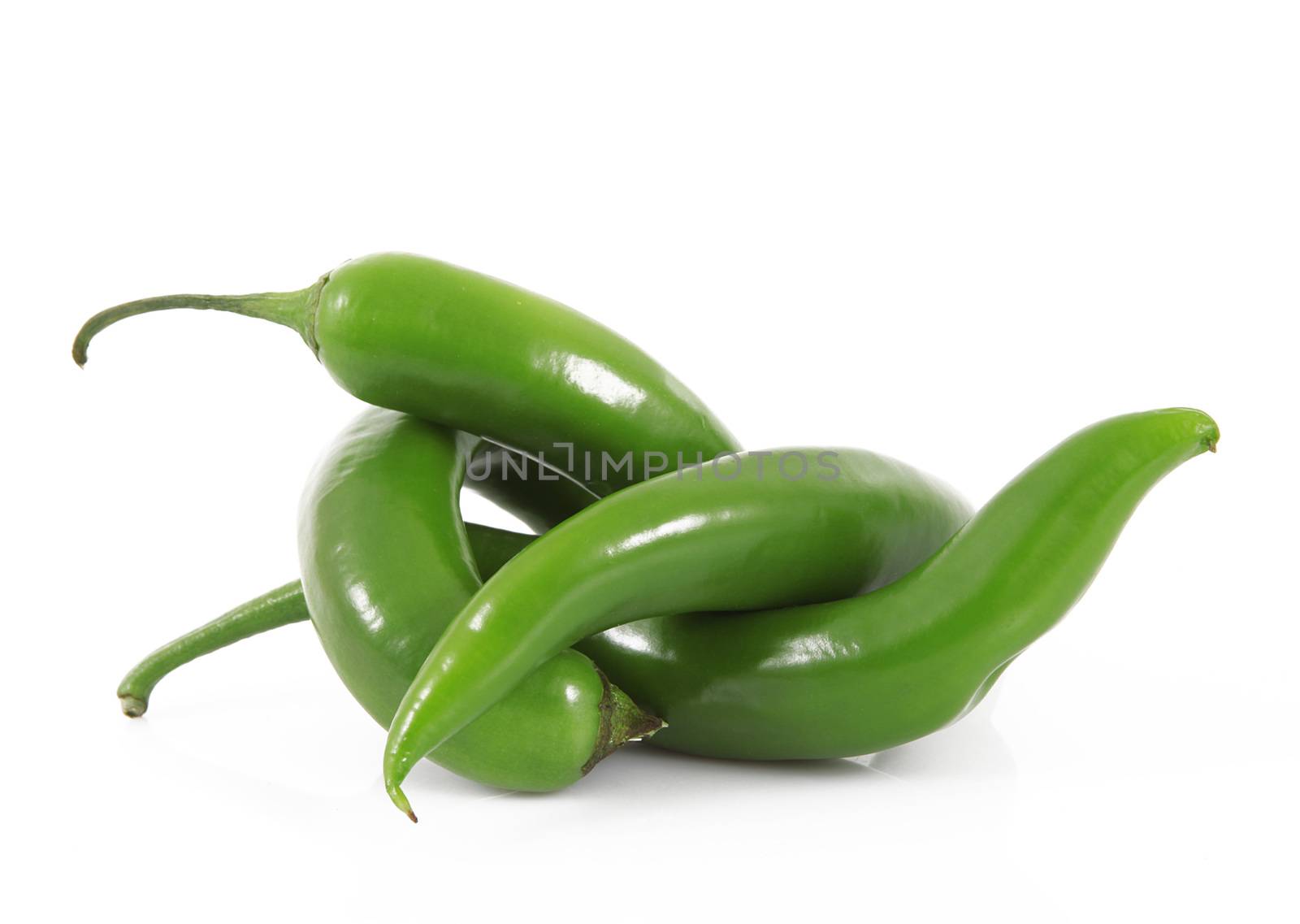 fresh hot peppers on white background
