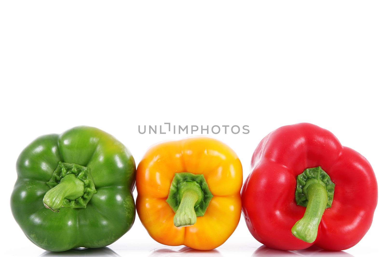 hot peppers on white background by photobeps