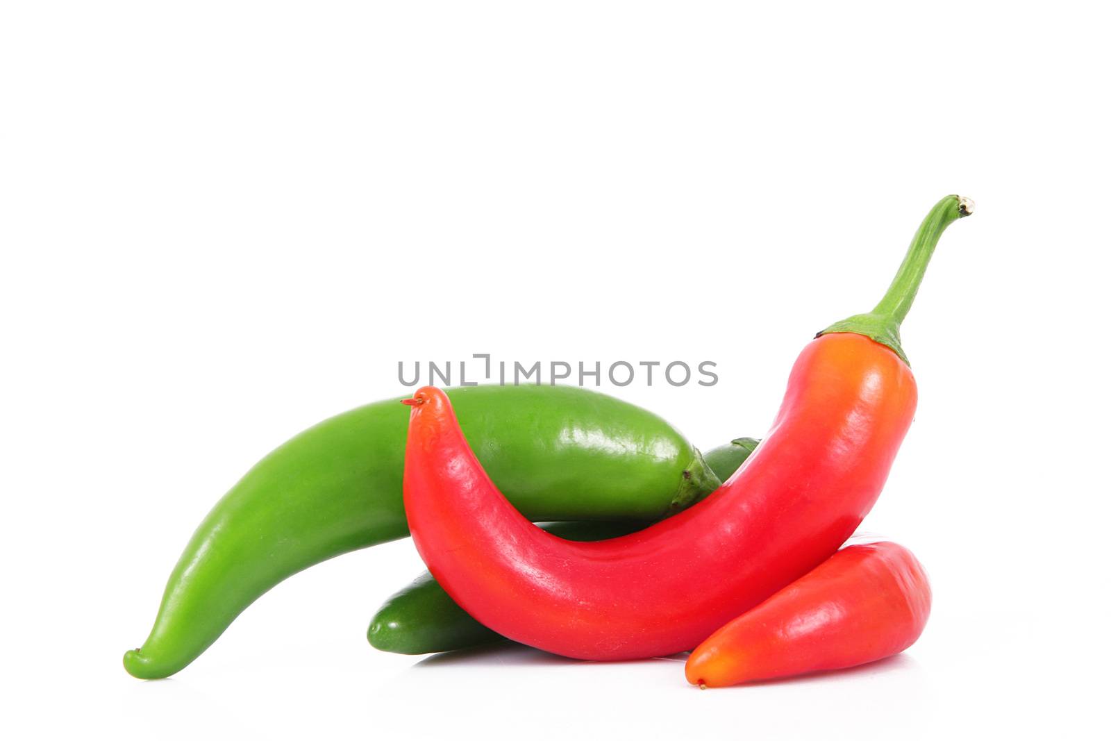 fresh hot peppers on white background