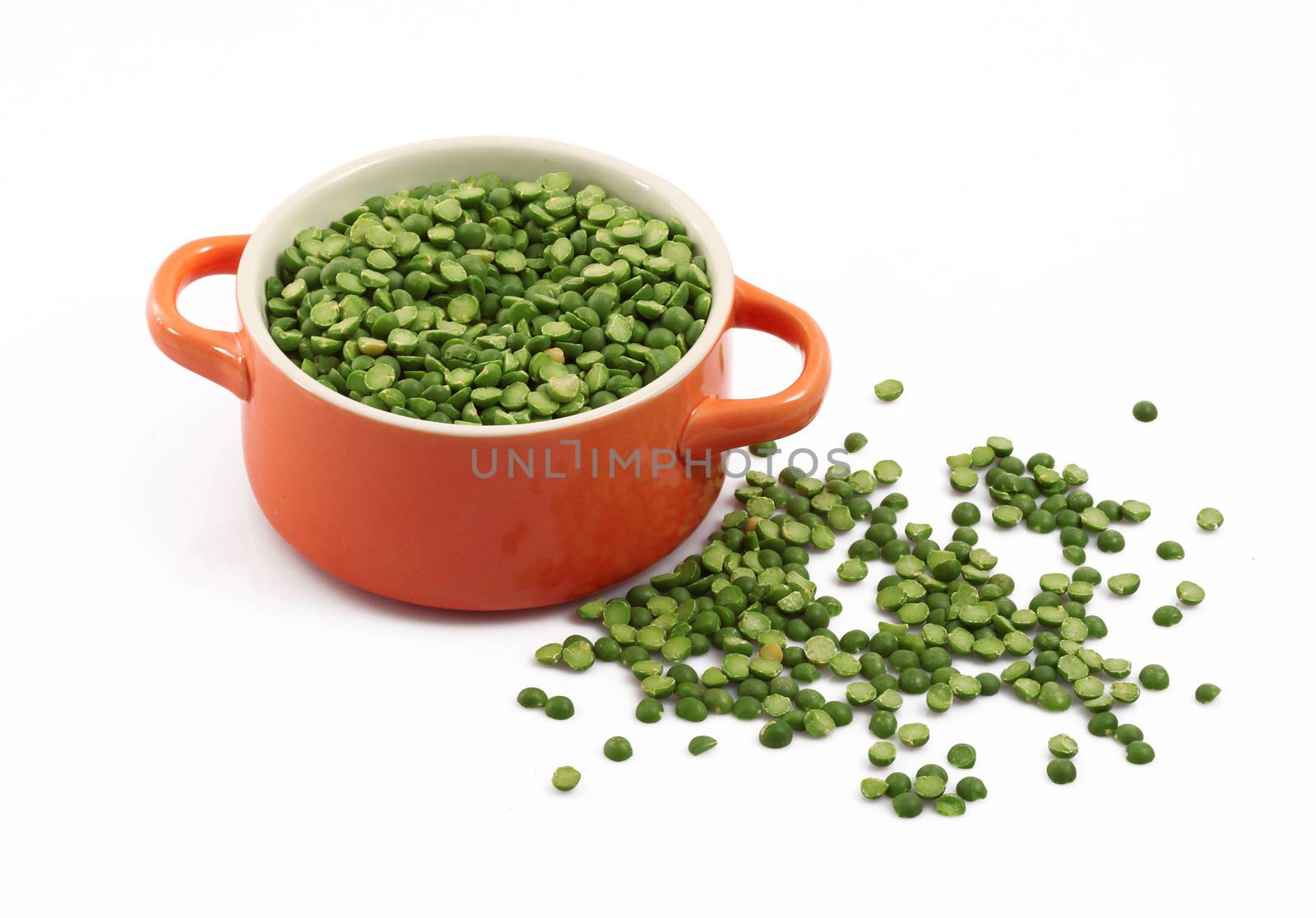 dry peas in pot on white background