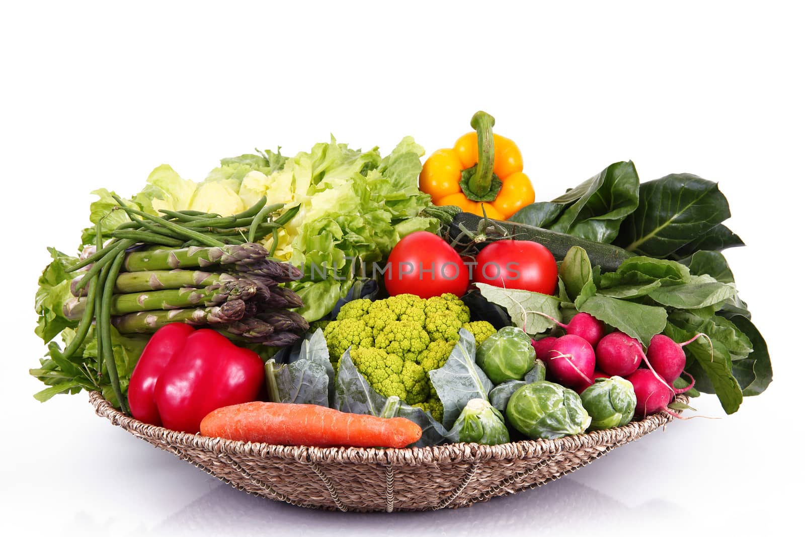 a fresh group of vegetables on white background