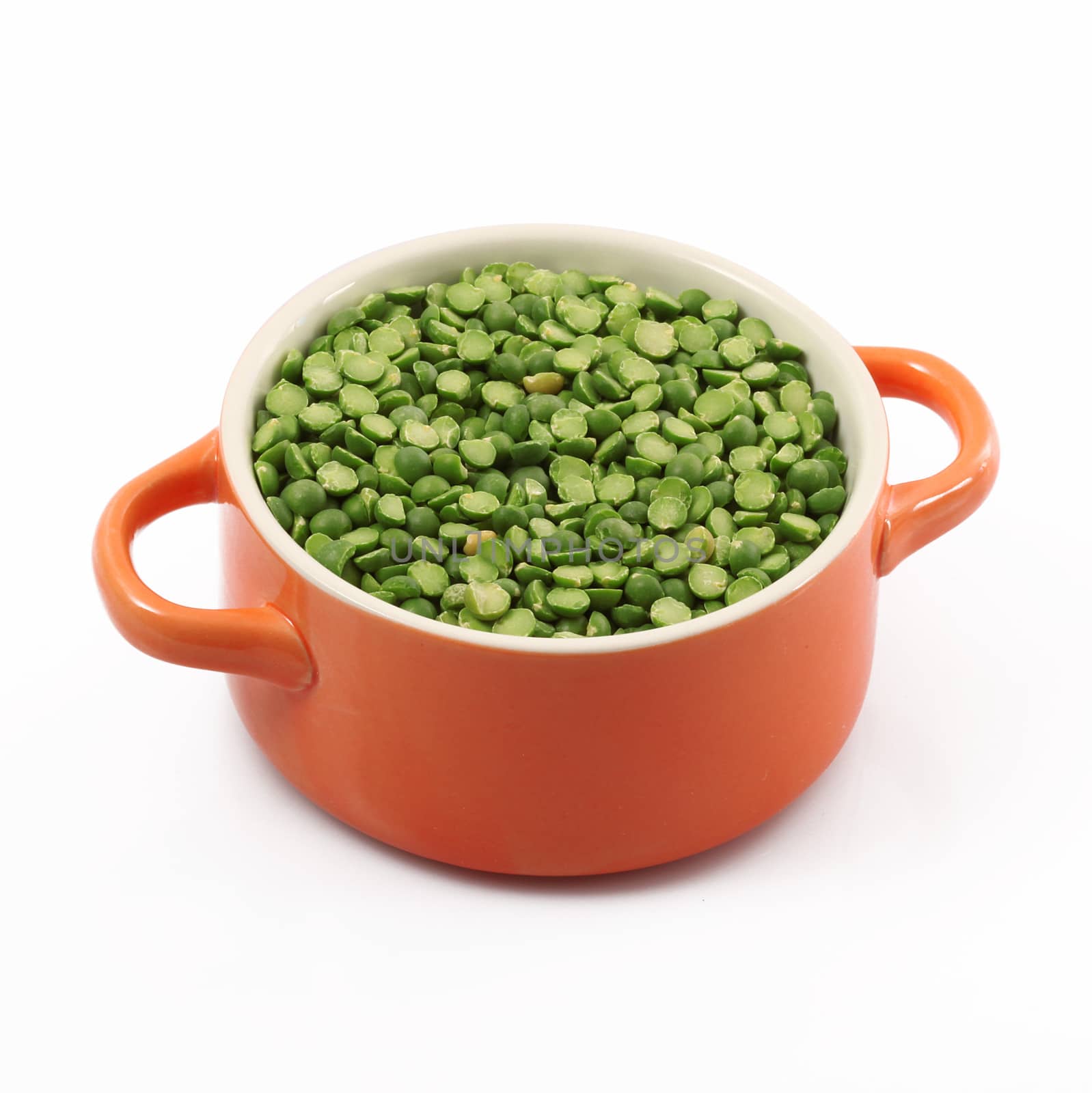dry peas in pot on white background