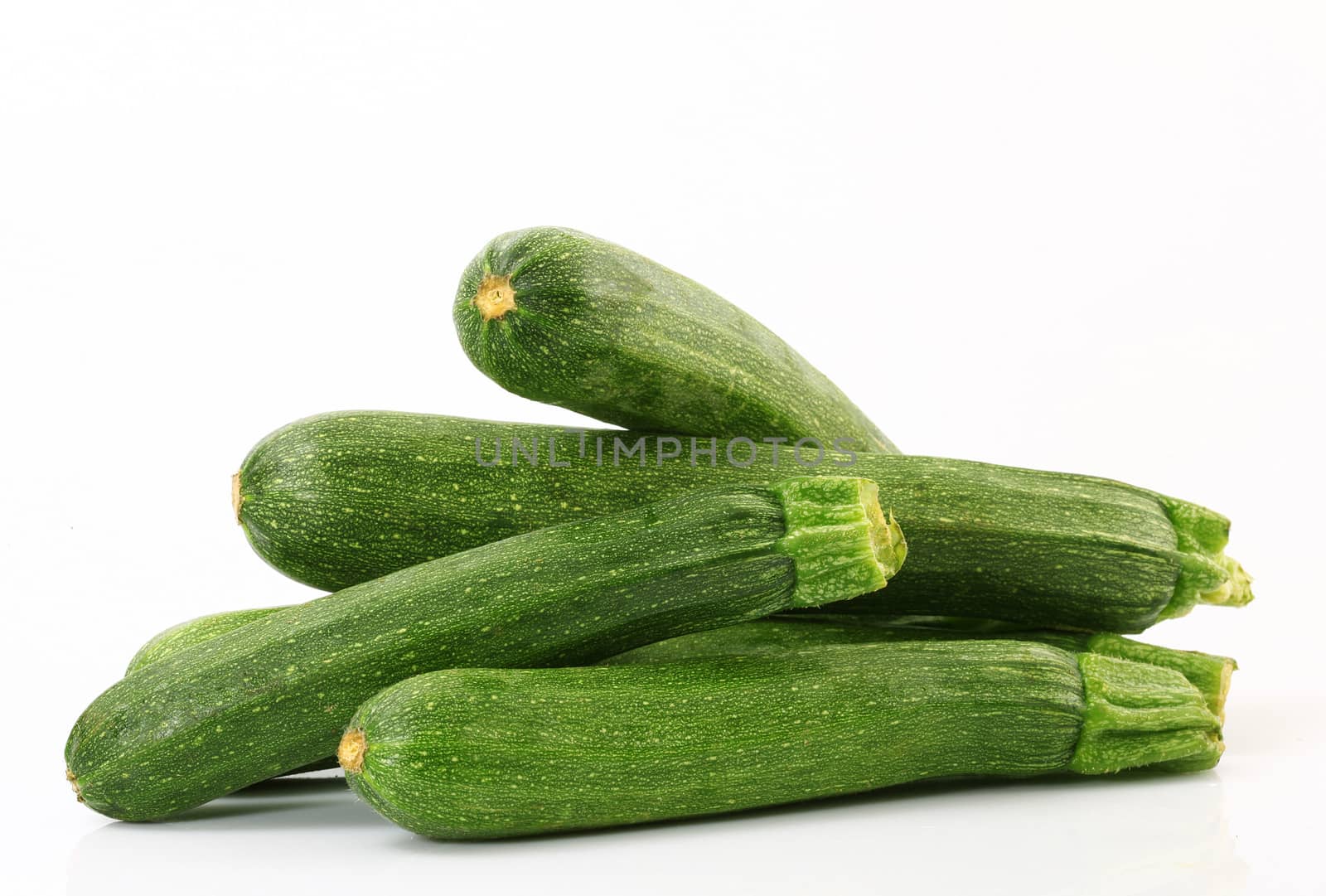 a fresh zucchini on white background