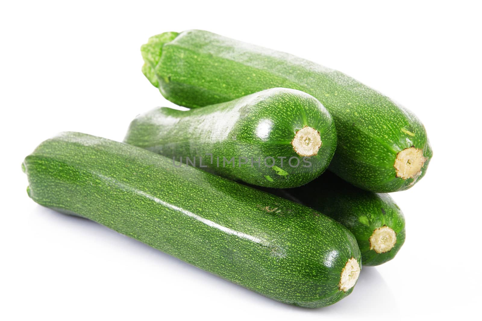 a fresh zucchini on white background