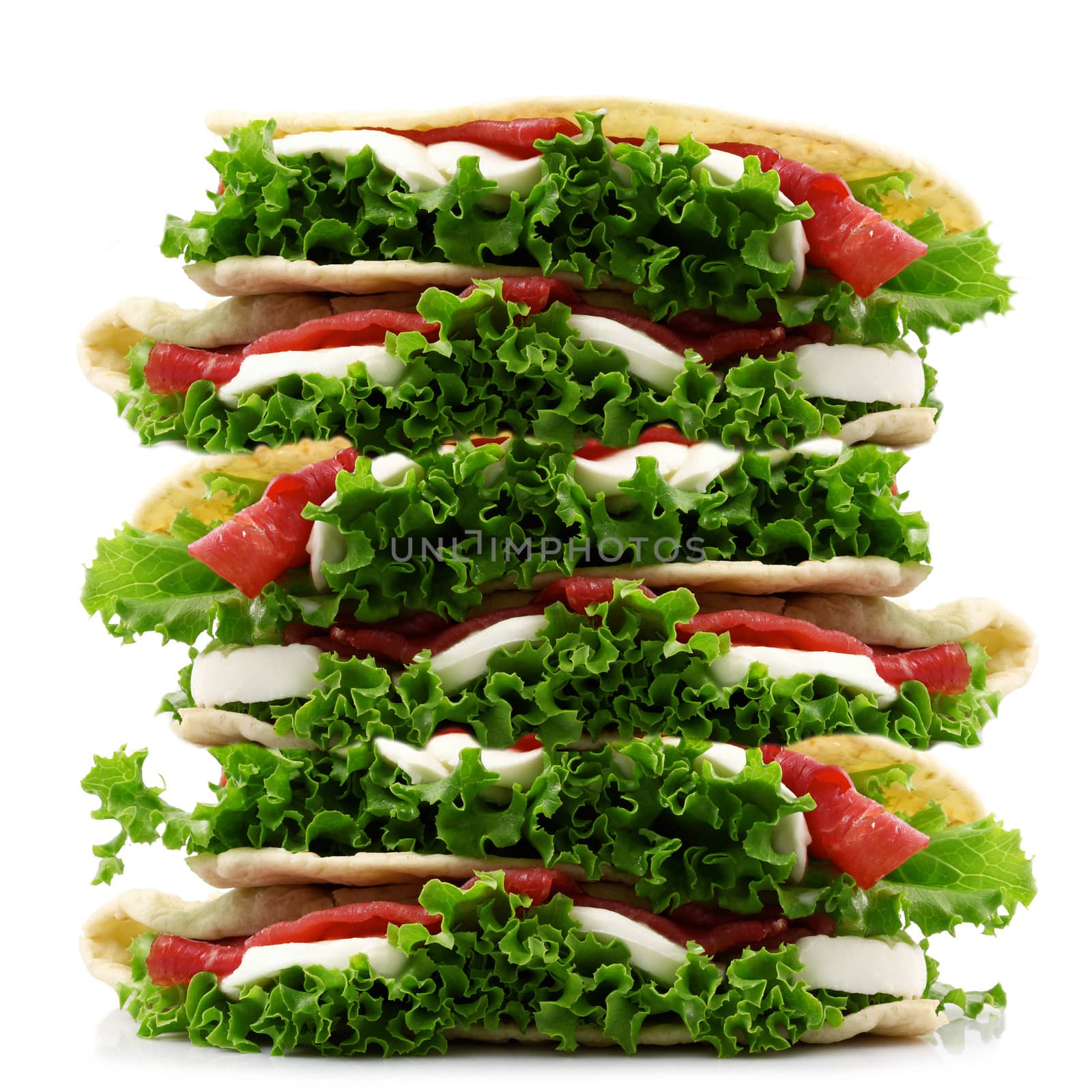very big italian flat bread with salade and ham