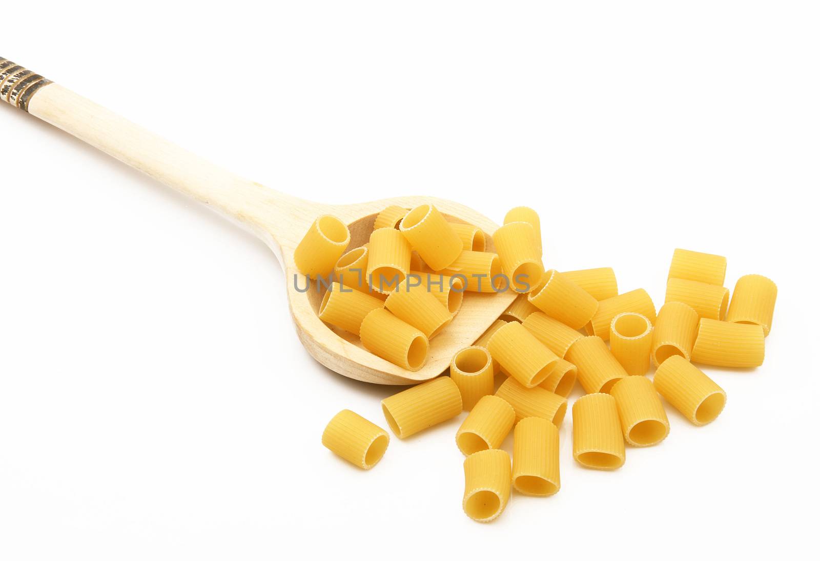 wood spoon with italian raw pasta on white background