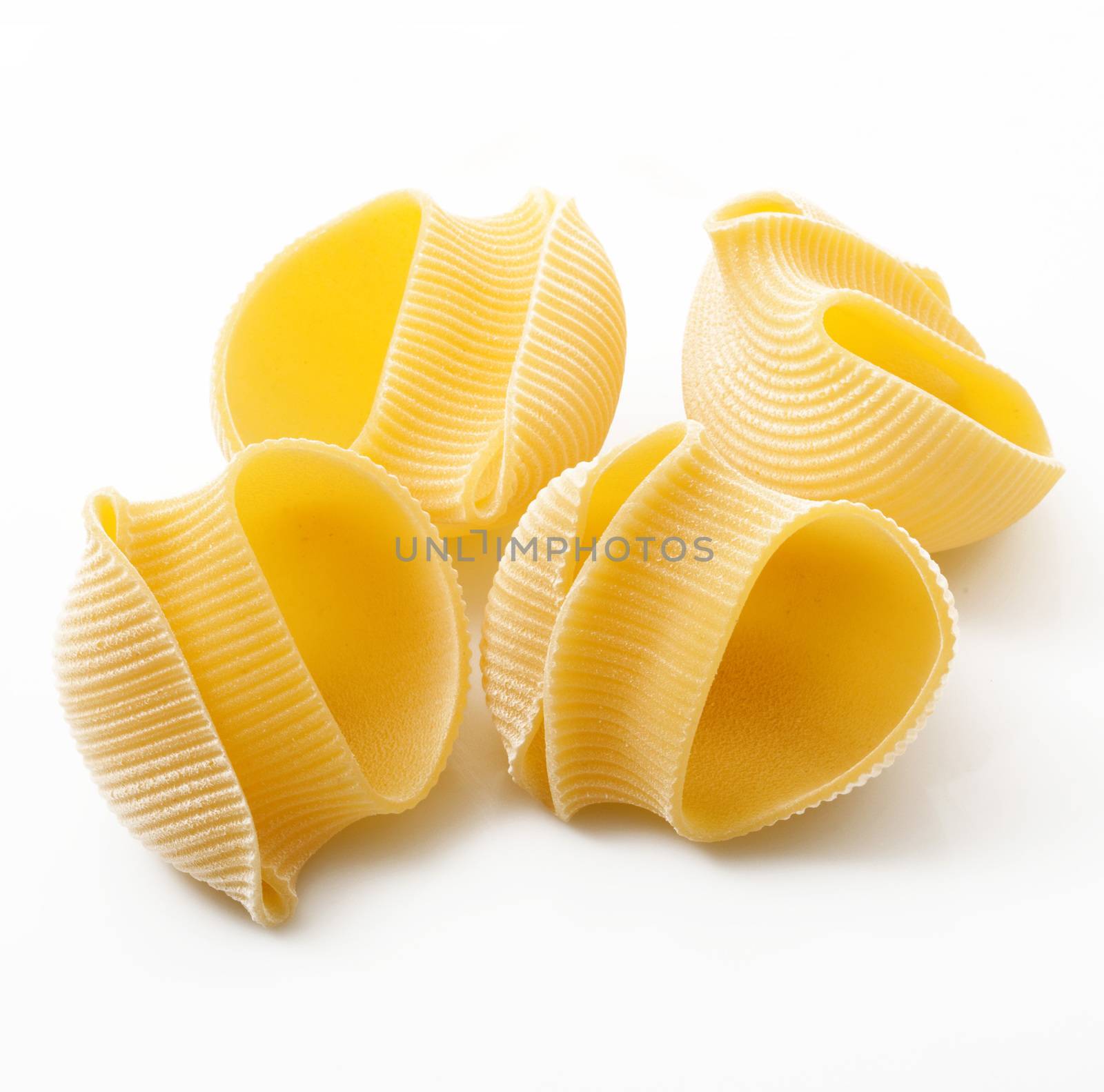 italian raw pasta on white background