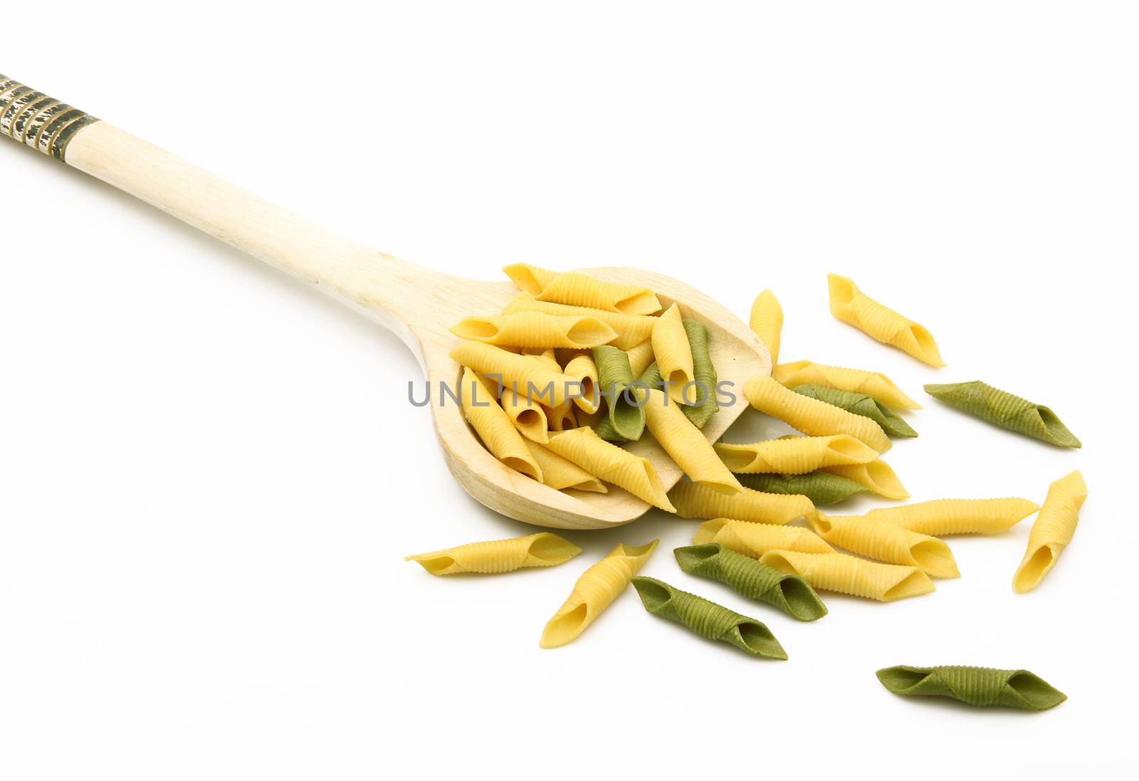 wood spoon with italian raw pasta on white background