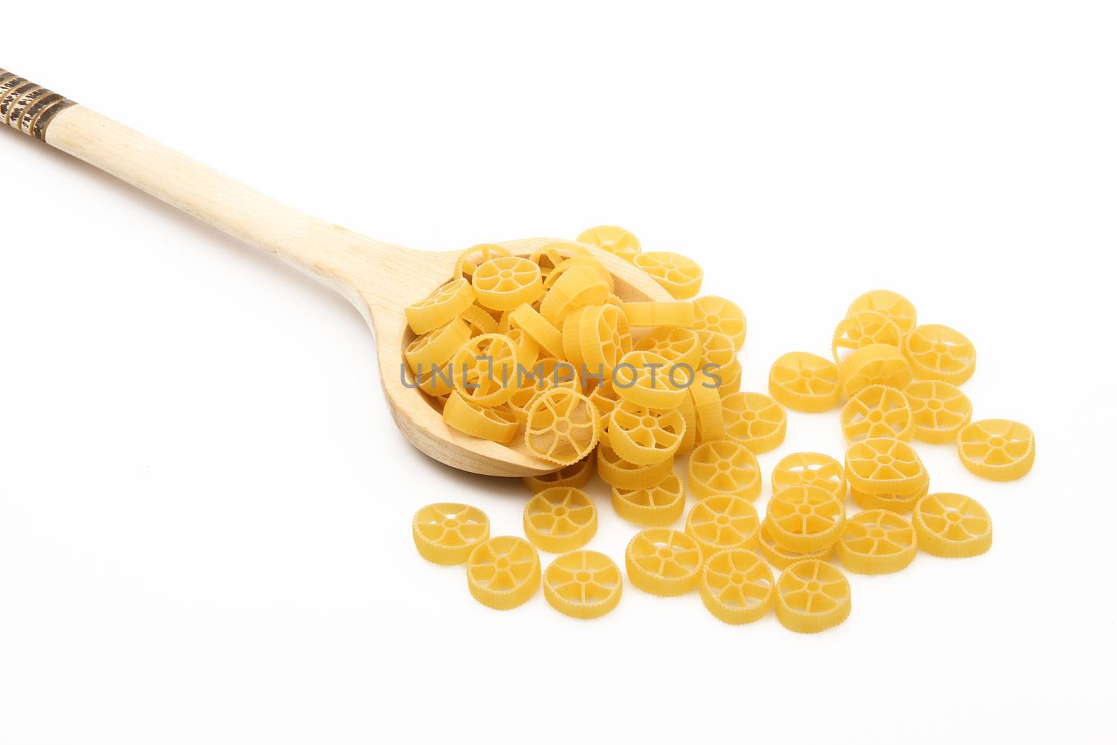 wood spoon with italian raw pasta on white background