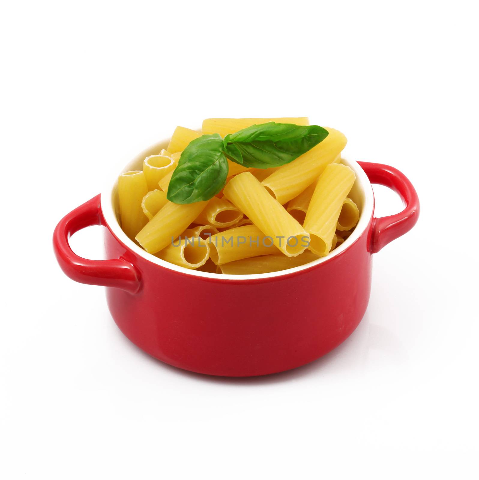 italian raw pasta in red pot