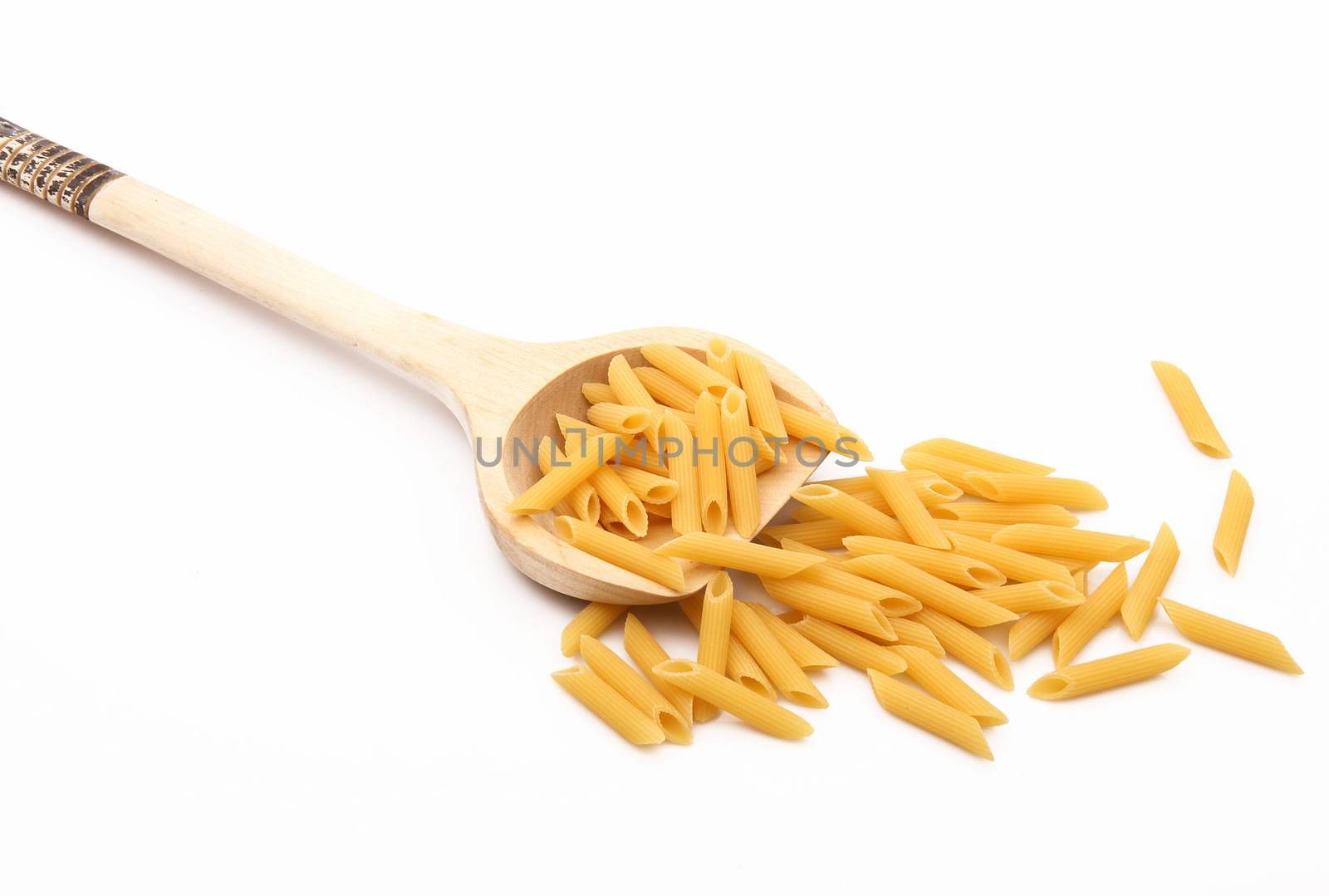 wood spoon with italian raw pasta on white background