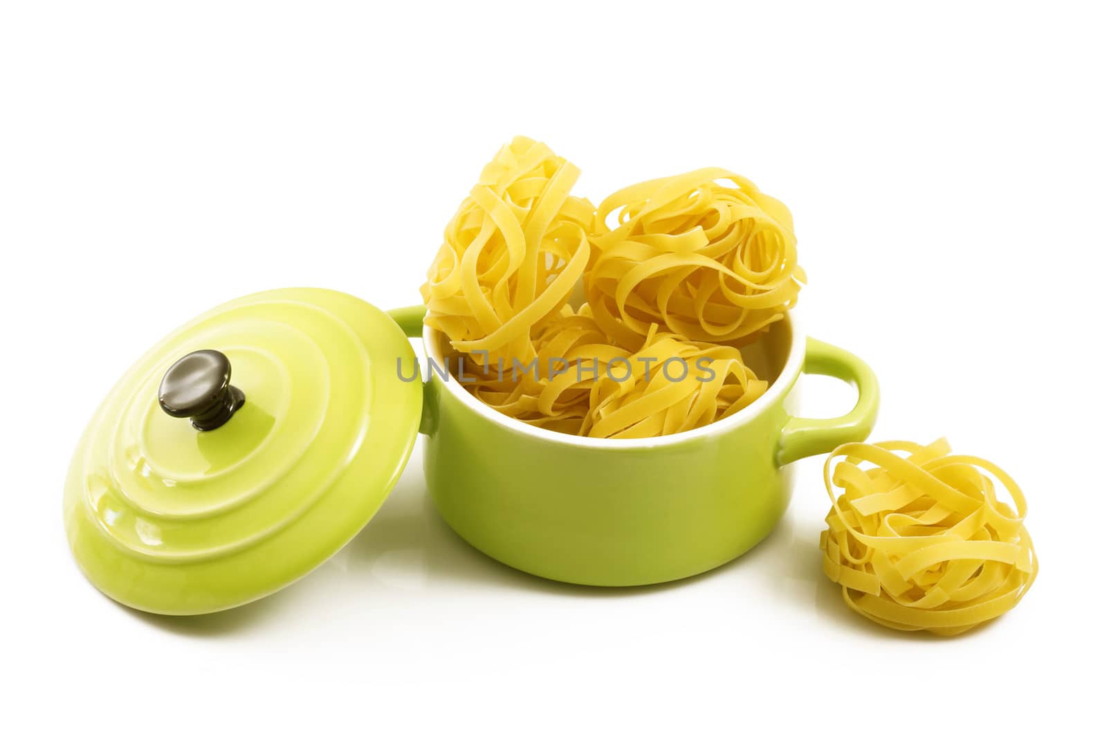 italian raw pasta in green pot