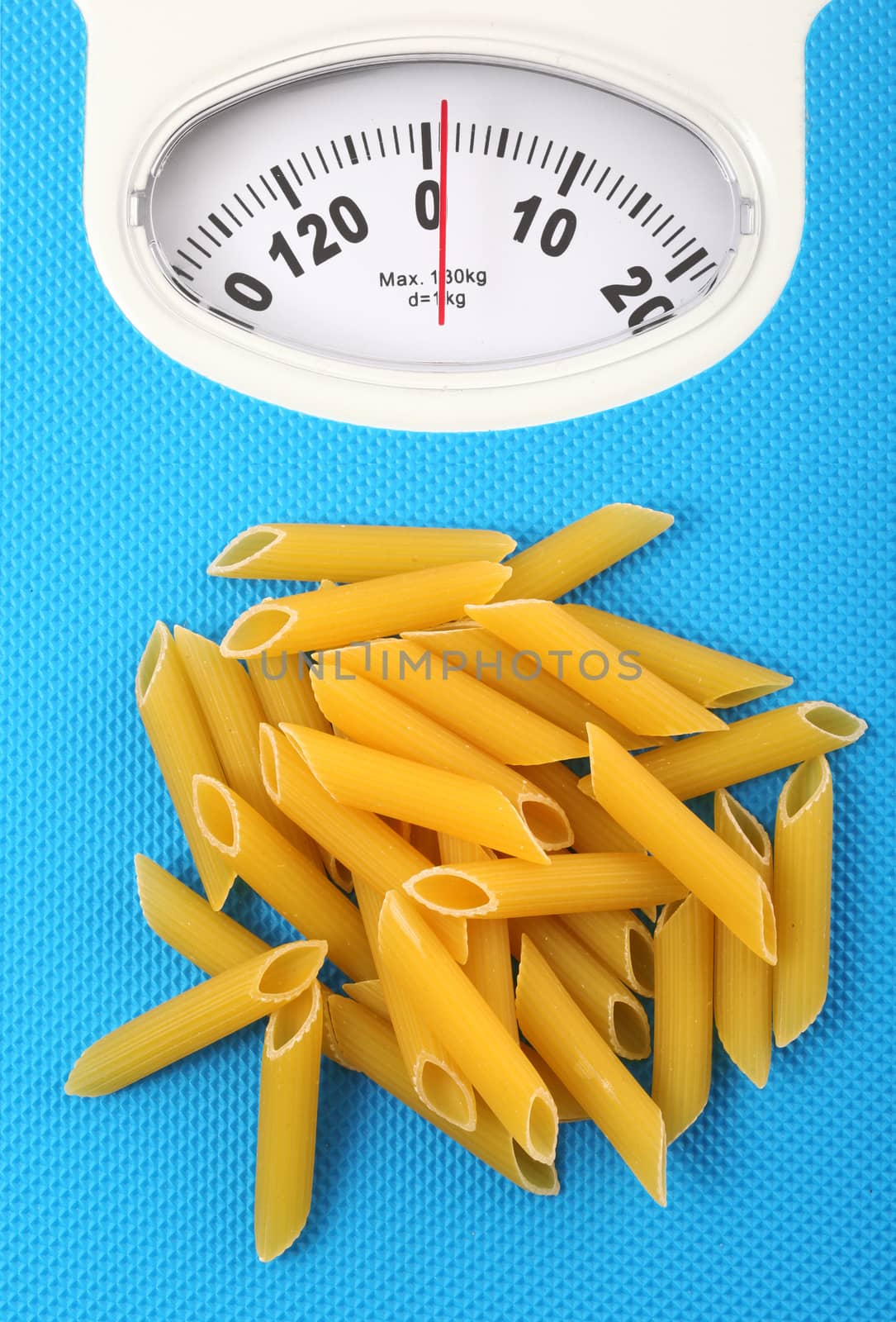 bathroom scale with italian raw pasta