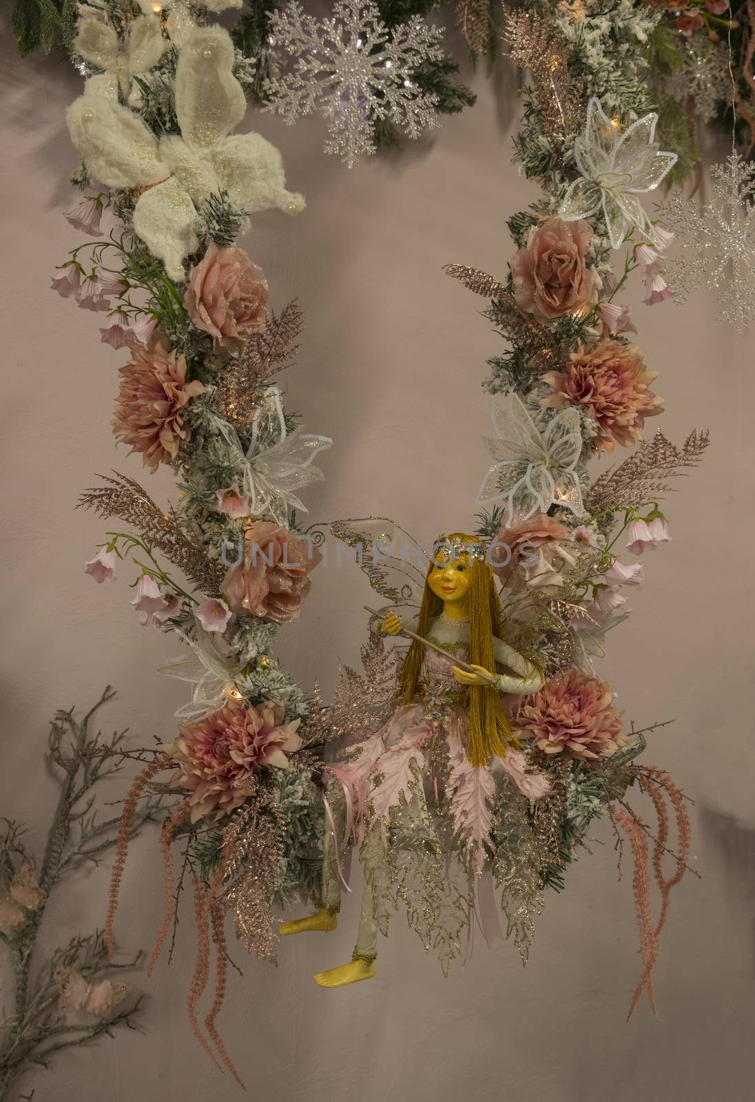 Amsterdam,Holland,18-oct-2018:beautifull christmas decoration with pink Christmas garland with fairy and floral ornament as a wreath