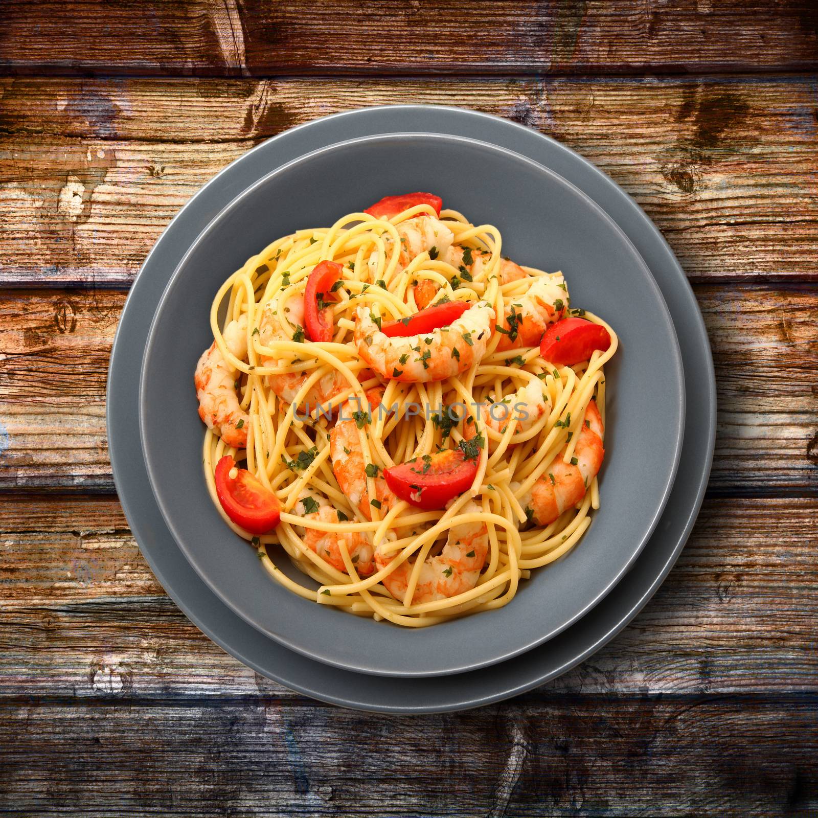 italian spaghetti with prawns ant tomato