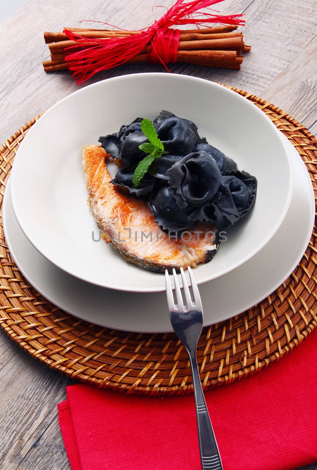 original italian ravioli with squid ink and salmon