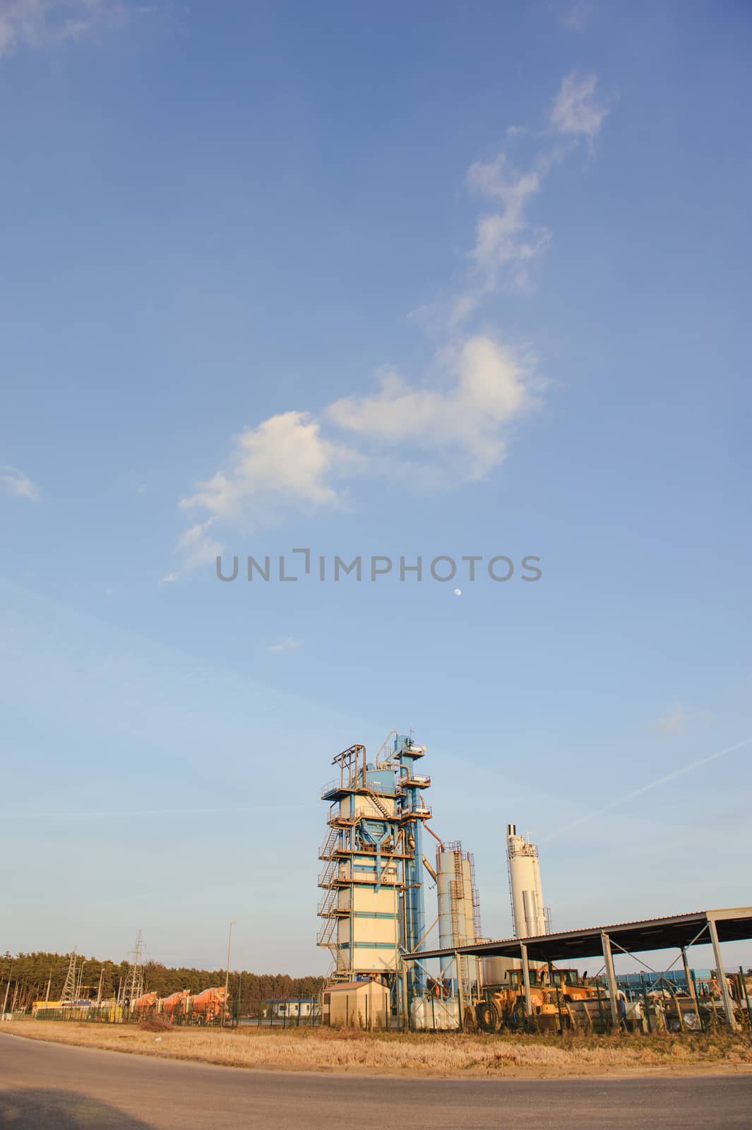 Modern industrial exterior building over blue sky