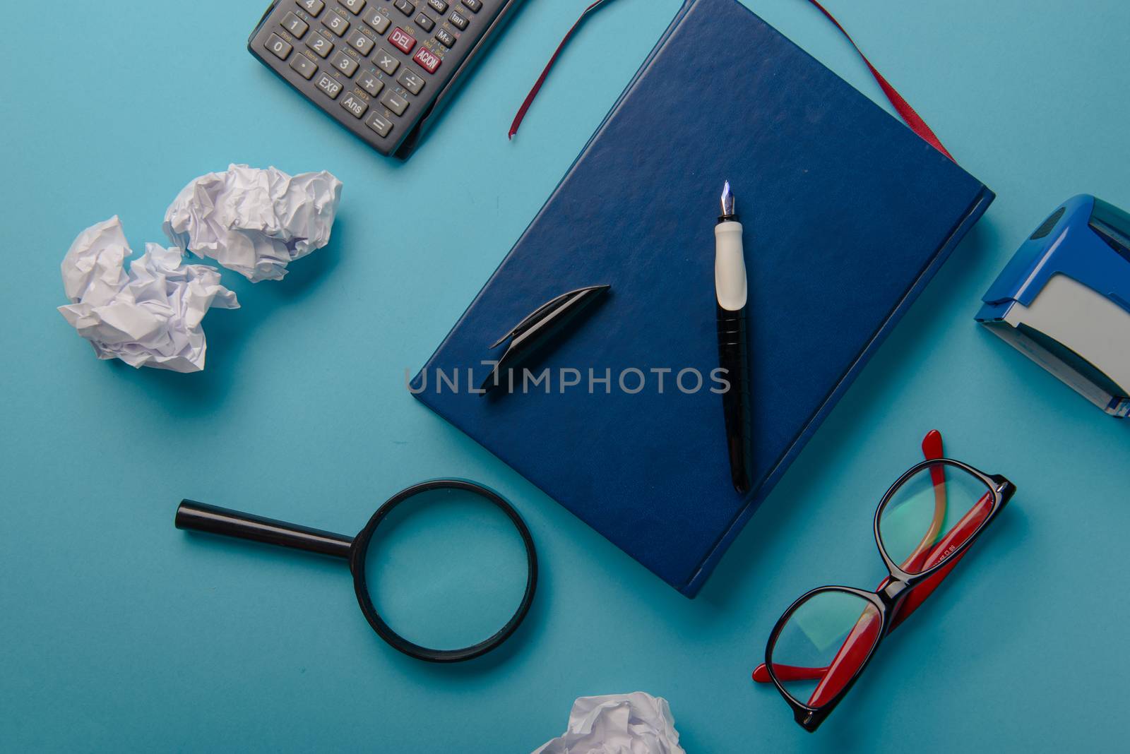 Desk with Tools and Notebook office desk on blue background
