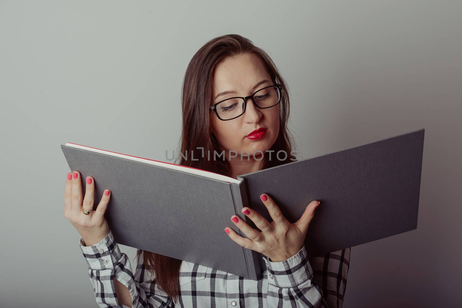 Business woman holding a wide open book
