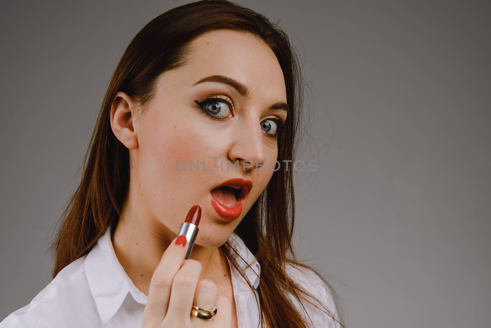 Professional Make-up. Lipgloss. Red Lipstick applying