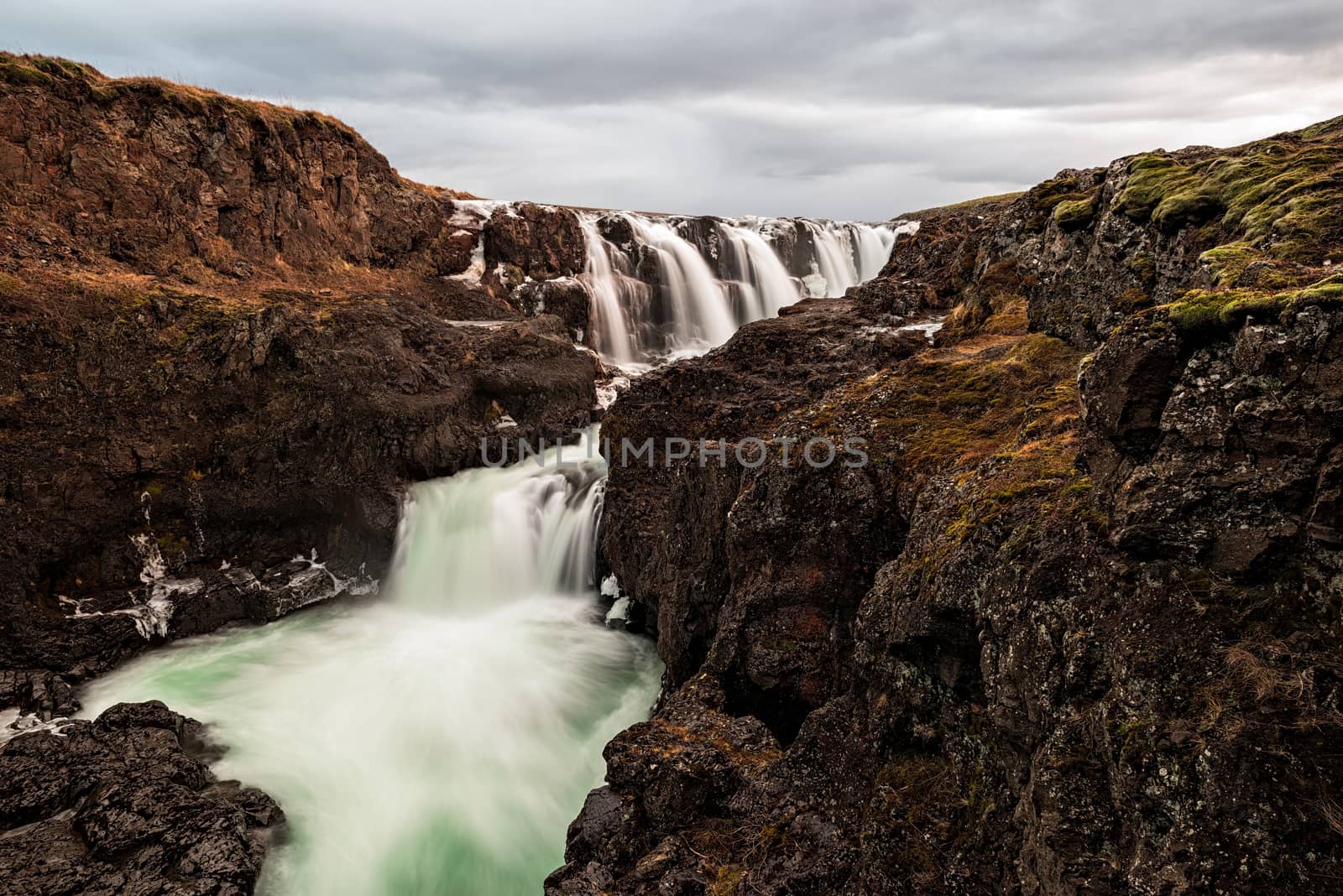 Kolugljufur waterfall in Iceland in a cloudy day