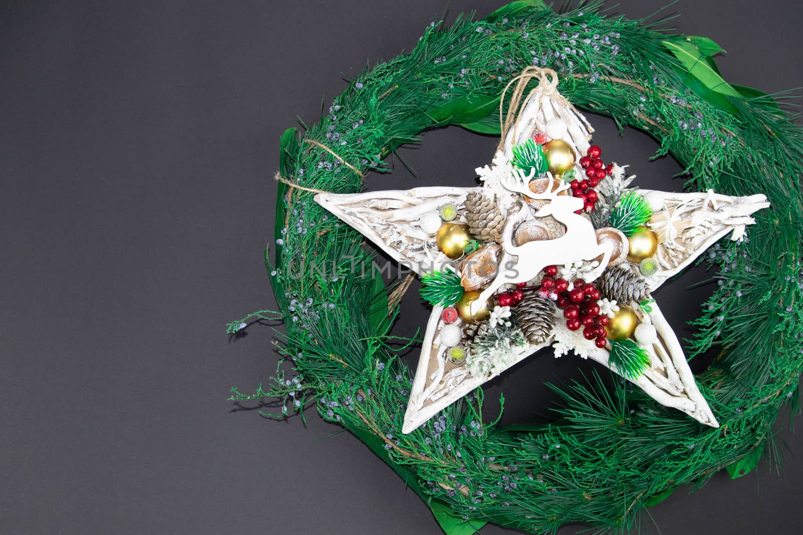 Christmas wreath with handmade star and deer, with left free part for text