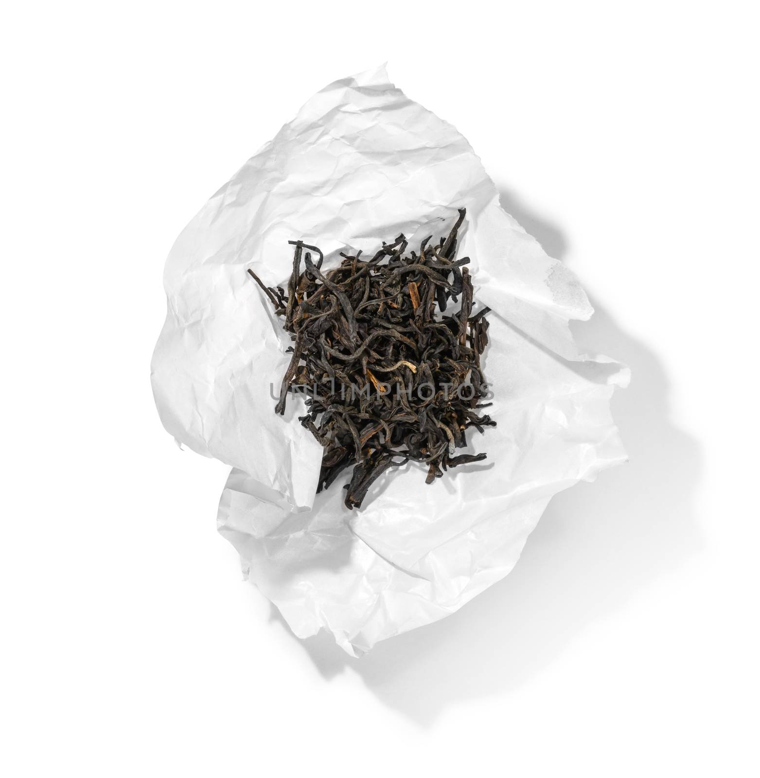 Black tea top view on white background by butenkow