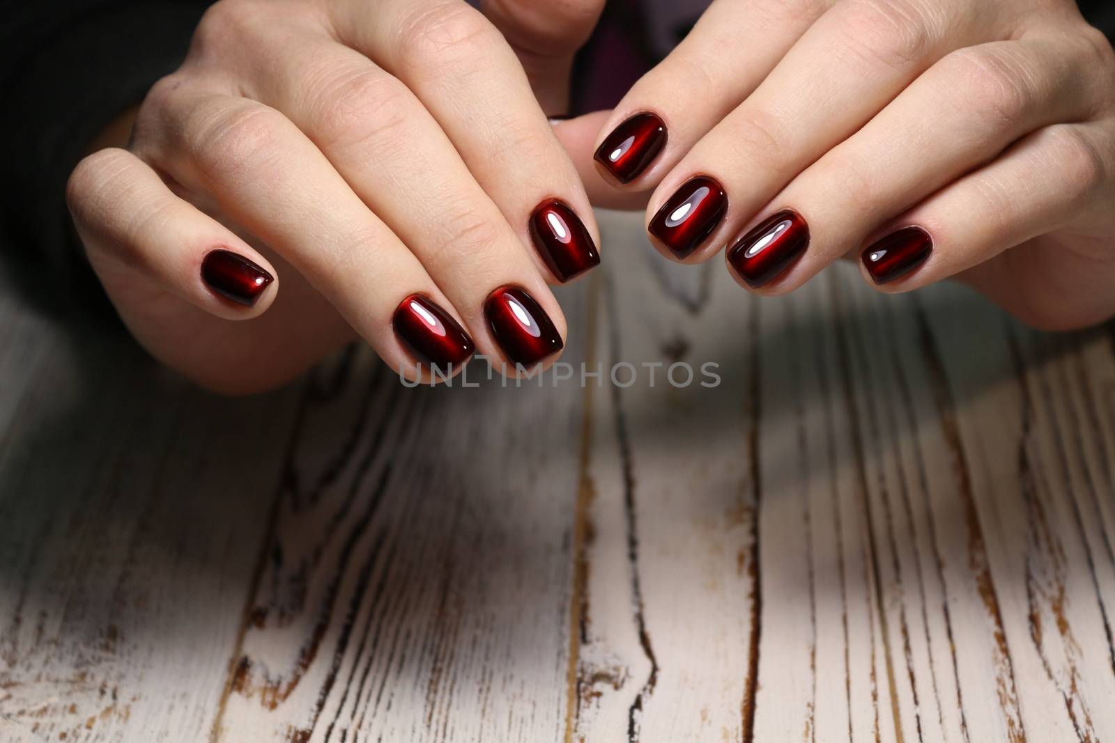 sexy gray manicure on a trendy texture background