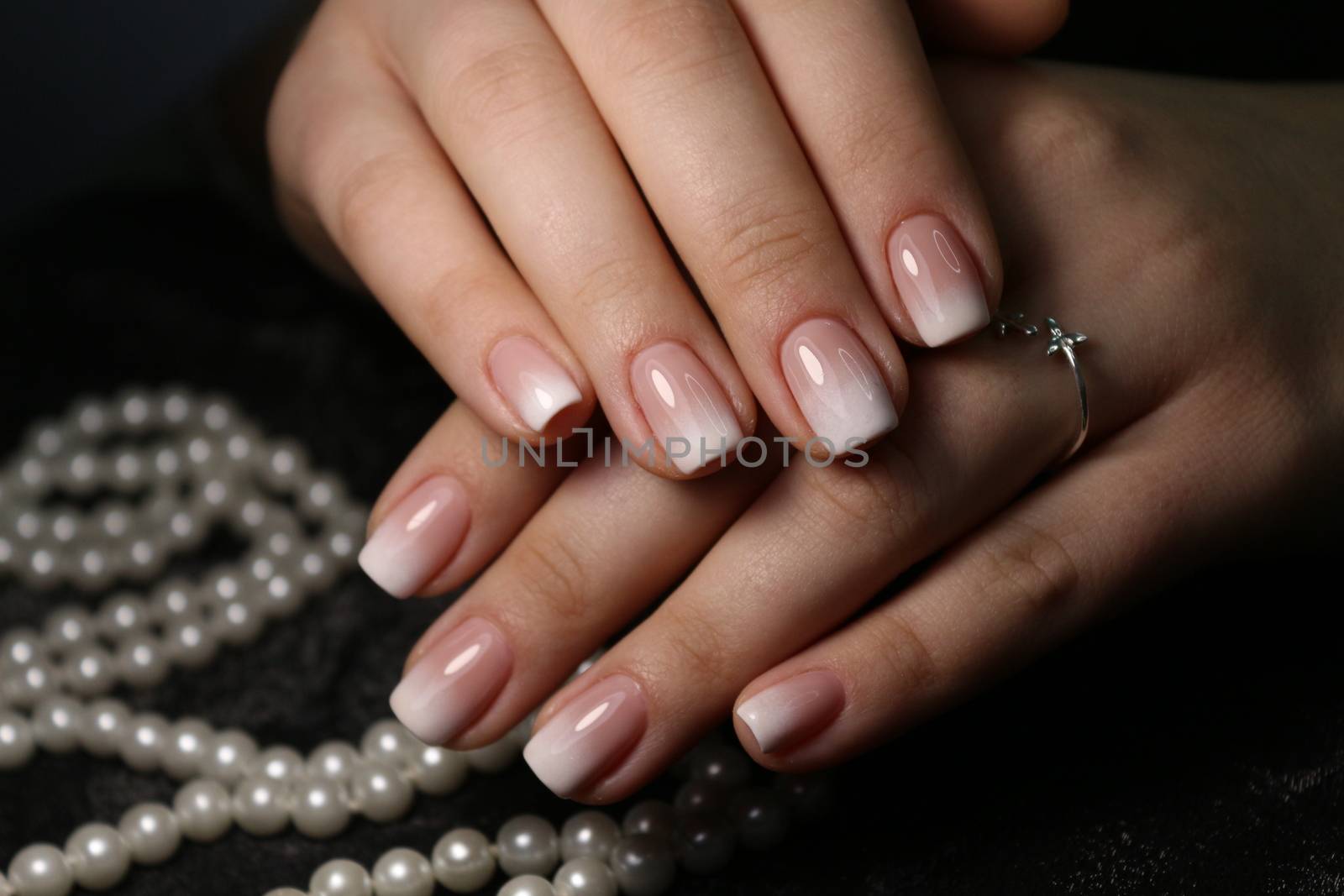 glamorous beautiful manicure on a trendy texture