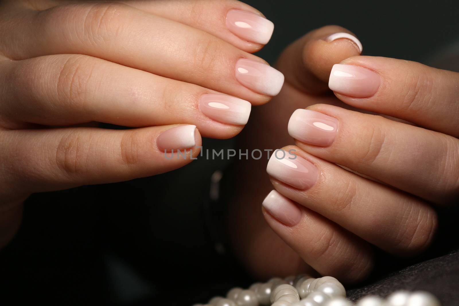 Cute manicure on female hands. Woman hands