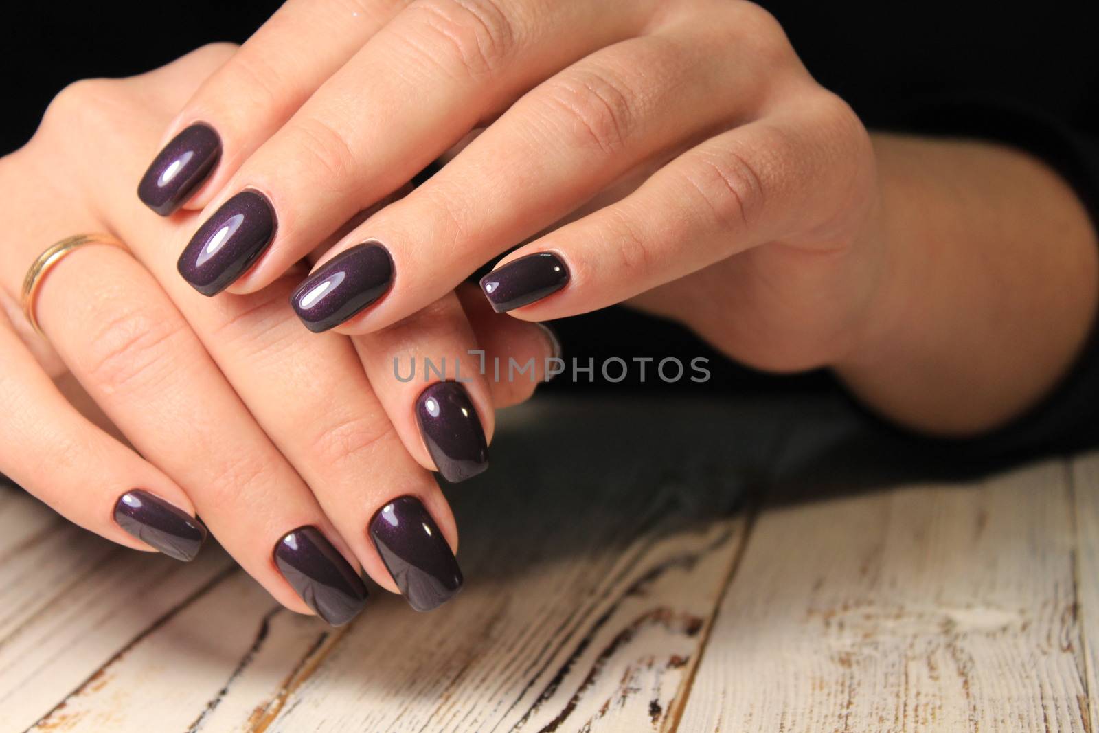 glamorous beautiful manicure on a trendy texture