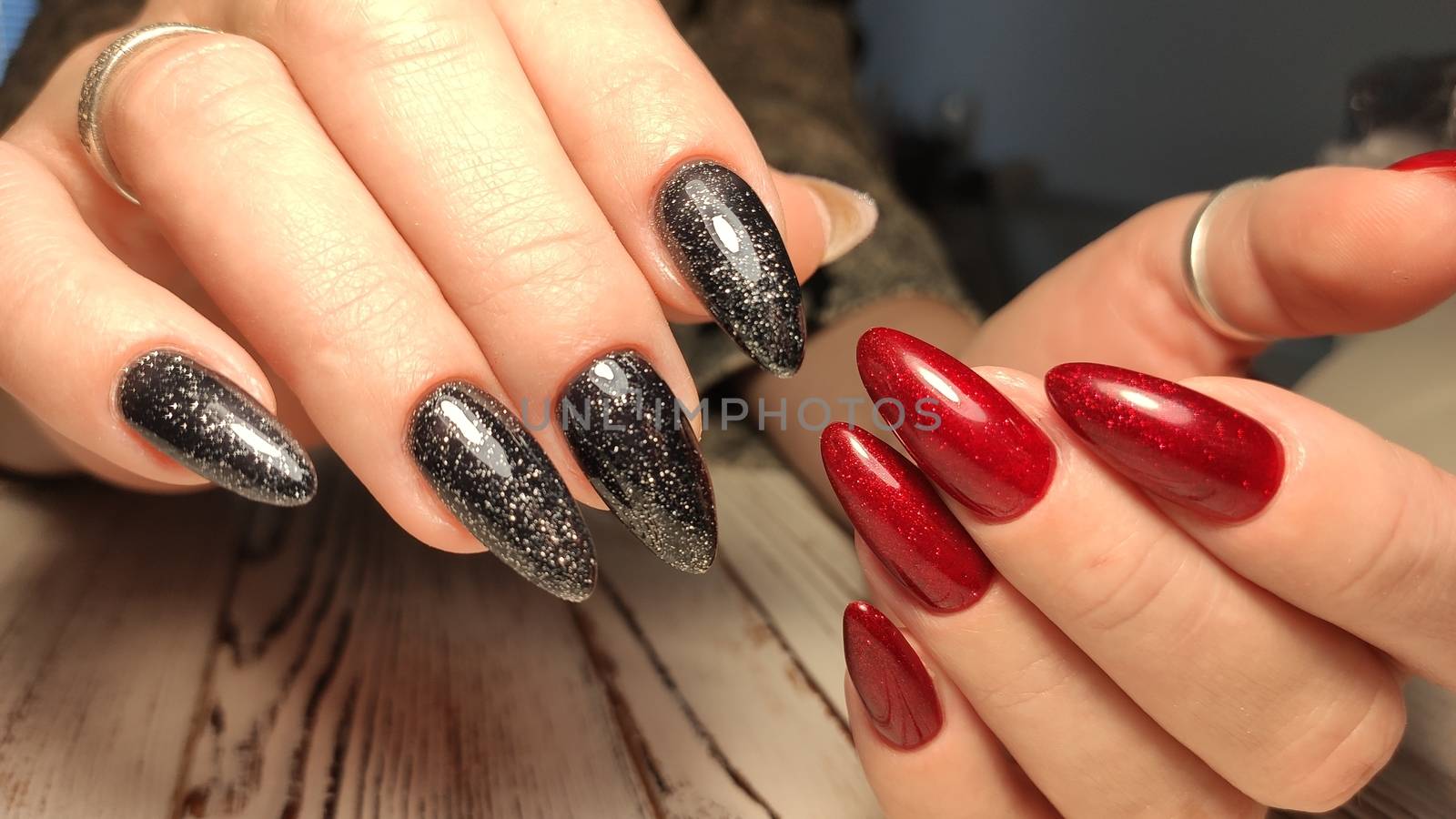 Glamorous luxurious brown crocodile manicure with gold plated women's nails closeup.
