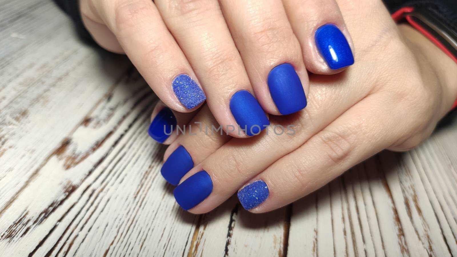 beautiful gel lacquer manicure on a textured trendy background by SmirMaxStock