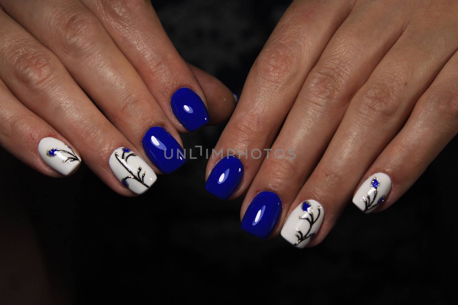 Cute manicure on female hands. by SmirMaxStock