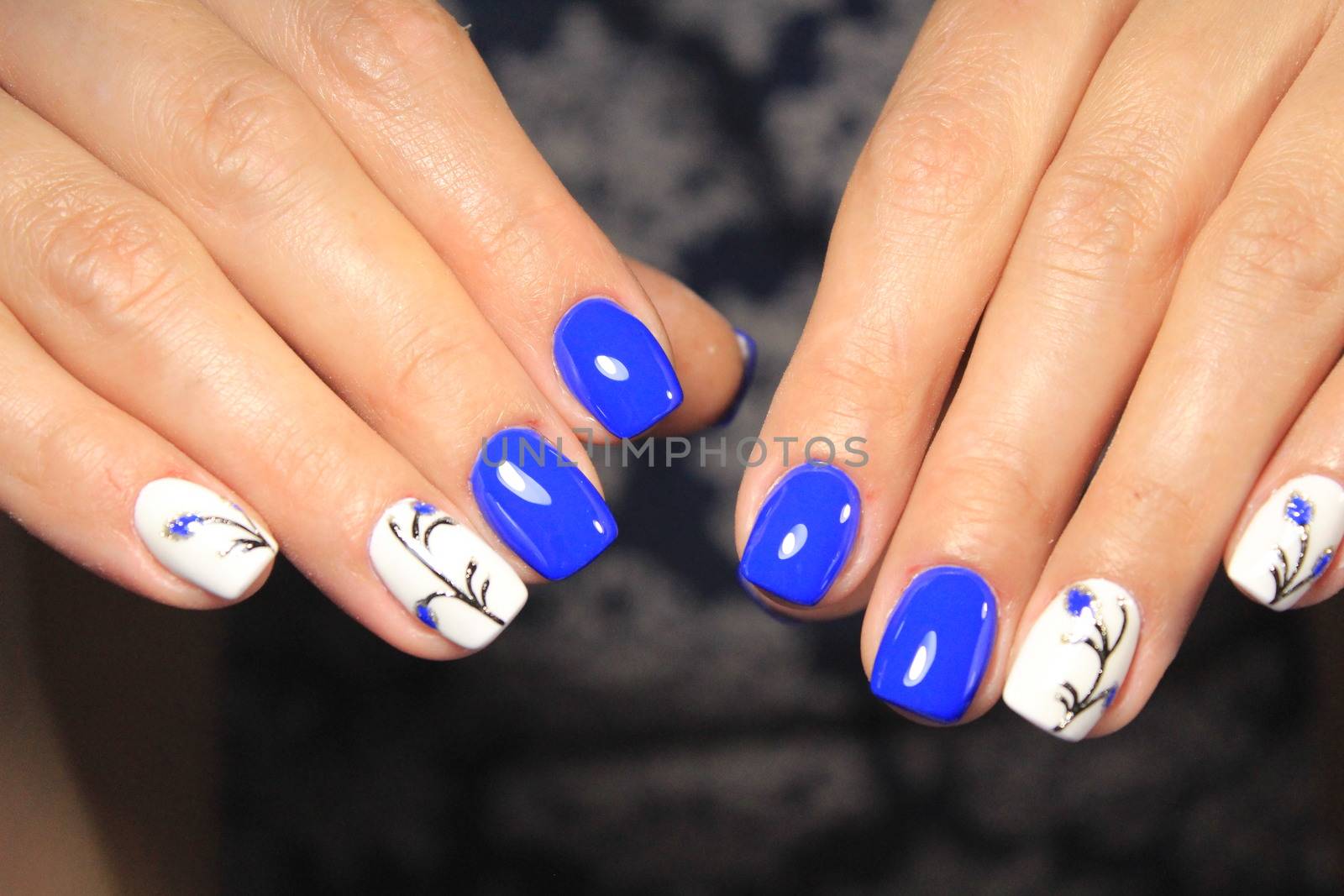fashionable beige manicure with a silver pattern design