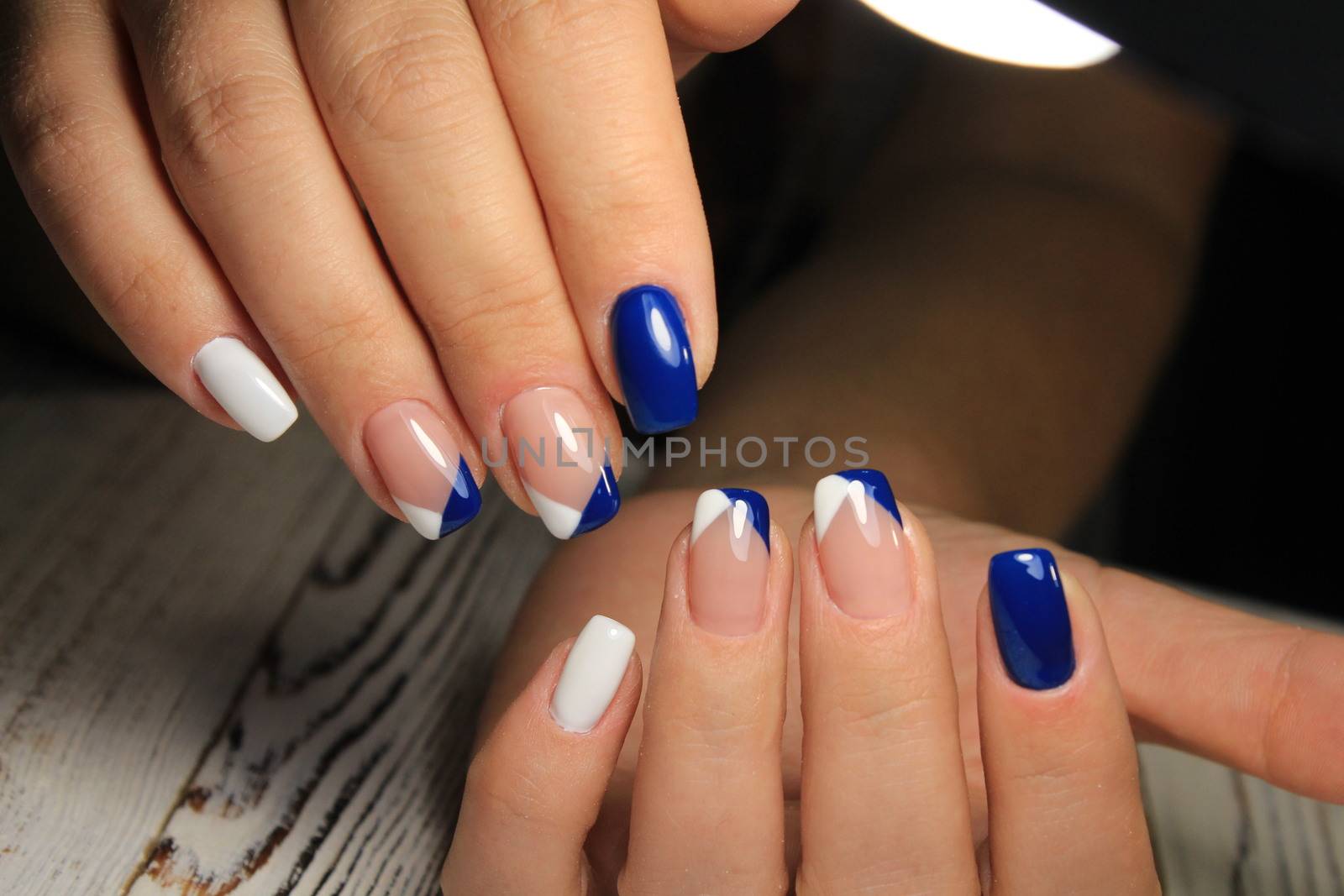 glamorous beautiful manicure on a trendy texture background by SmirMaxStock