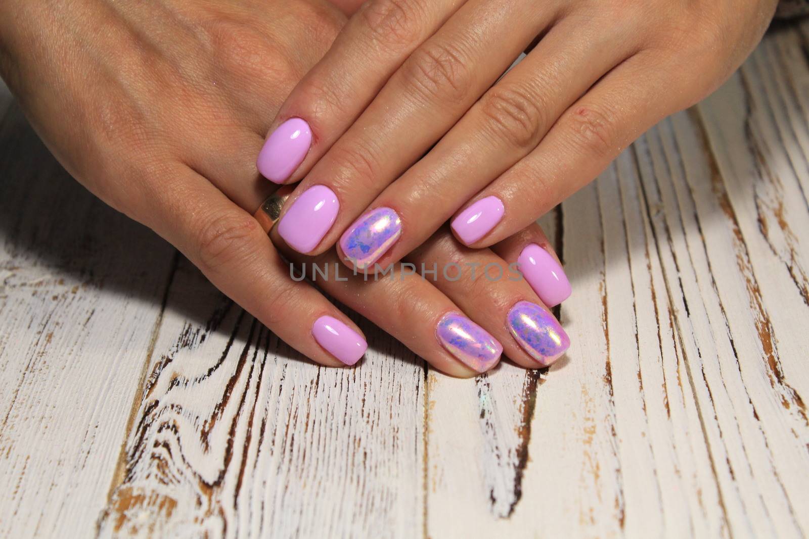 glamorous beautiful manicure on a trendy texture background by SmirMaxStock