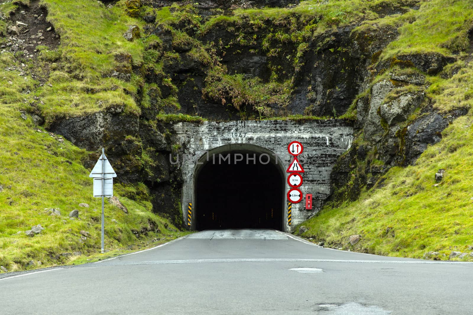 Narrow, unlit tunnel in the Faroe Islands
