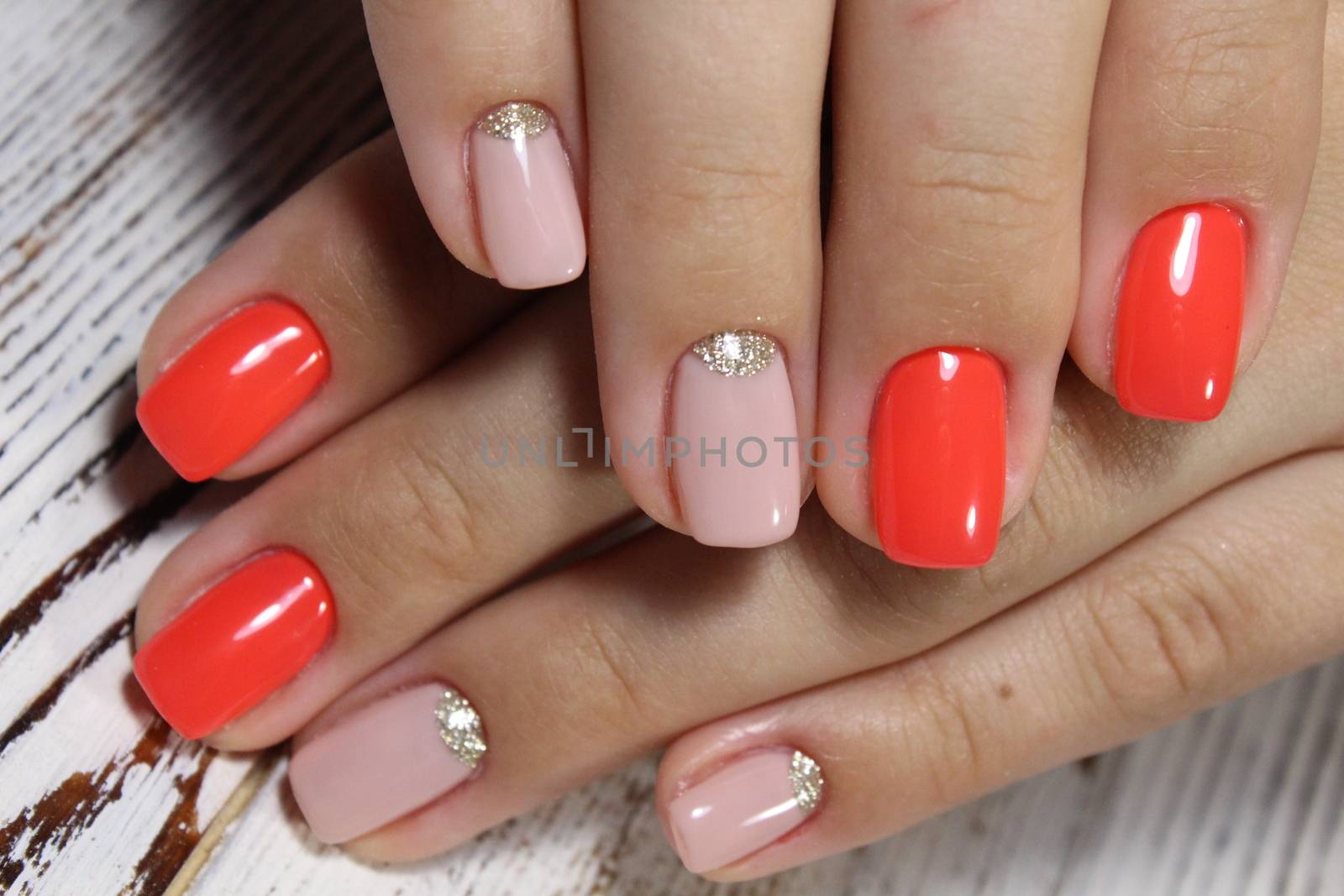 Sexual pink manicure on beautiful female hands