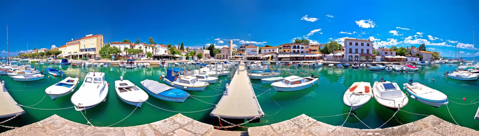 Krk. Town of Malinska harbor and turquoise waterfront panoramic view, Krk island in Croatia