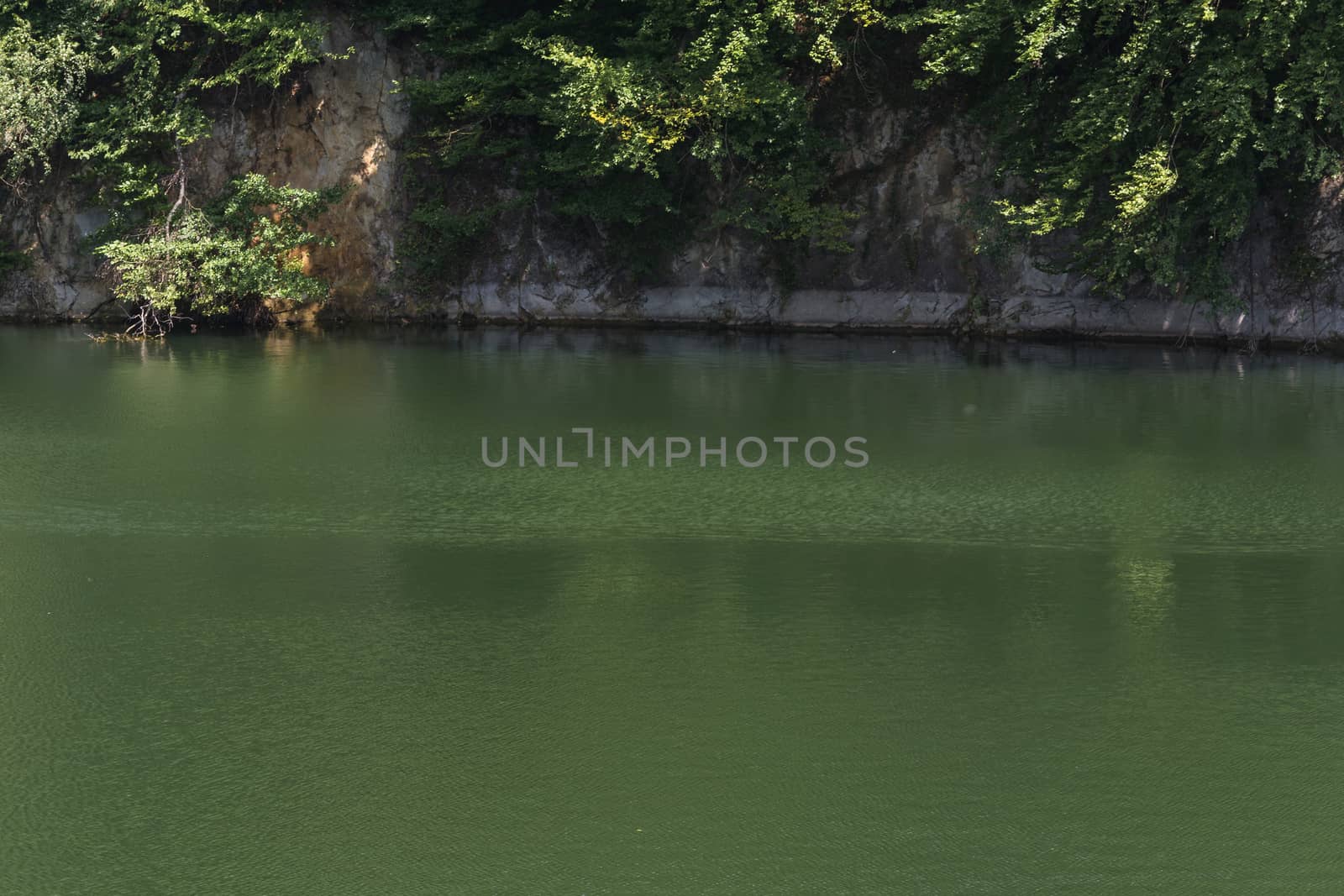 Lake with banks on the site of a former quarry for the extraction of limestone