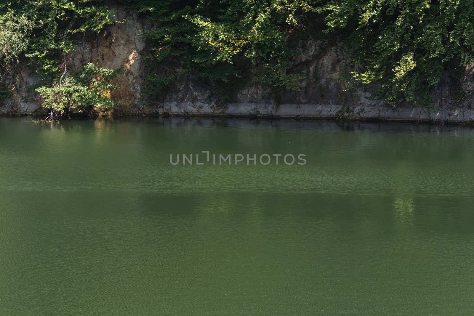 Lake with banks on the site of a former quarry for the extraction of limestone