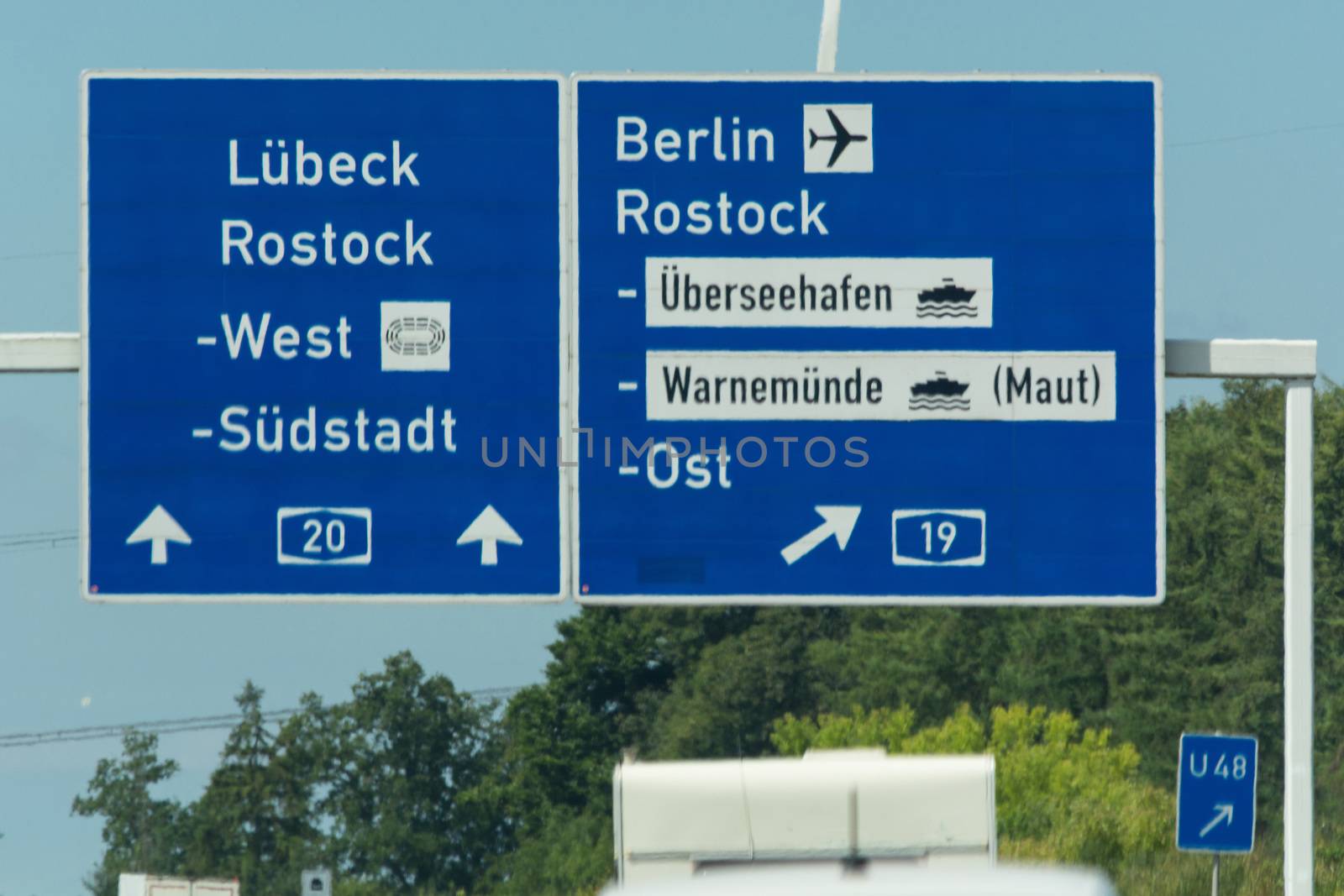 Autobahn sign in Germany Caption on German - city names Berlin, Berlin Airport,Rostock, Lübeck