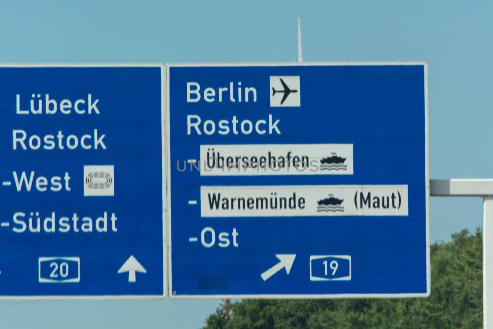 Autobahn sign in Germany Caption on German - city names Berlin,Berlin Airport, Rostock, Lübeck