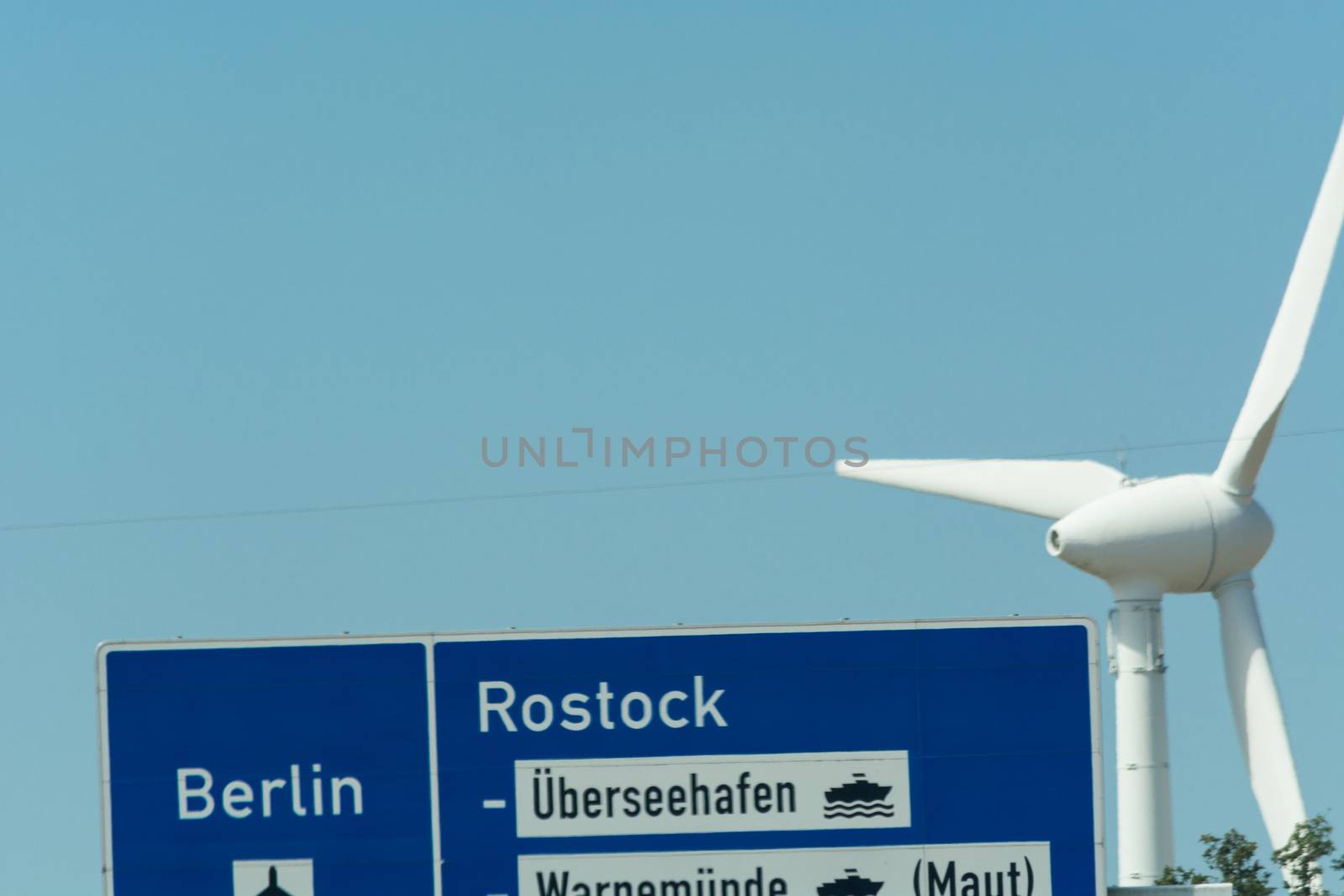 Autobahn sign in Germany Caption on German - city names Berlin,Berlin Airport, Rostock, Lübeck