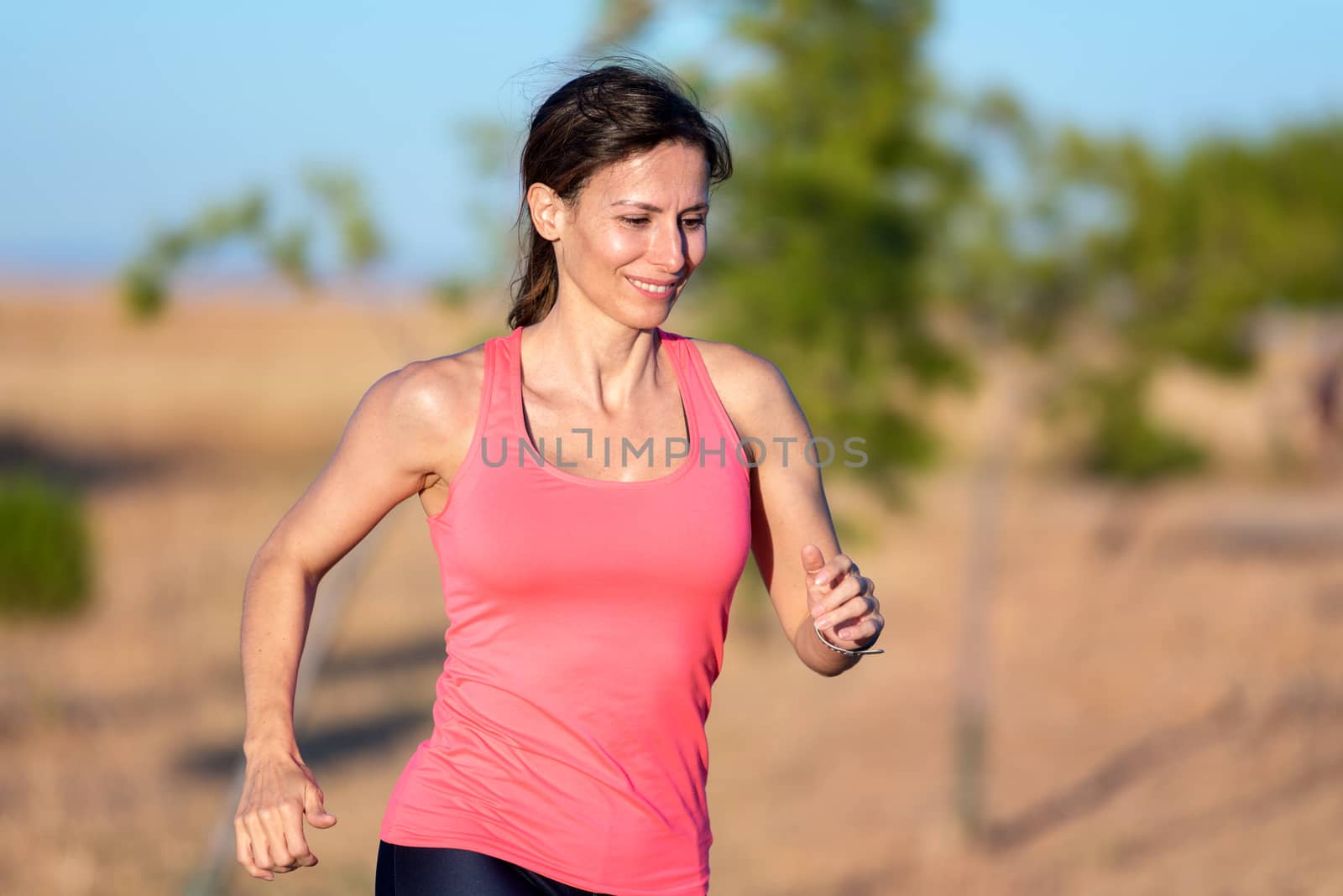 Fitness woman running in the park